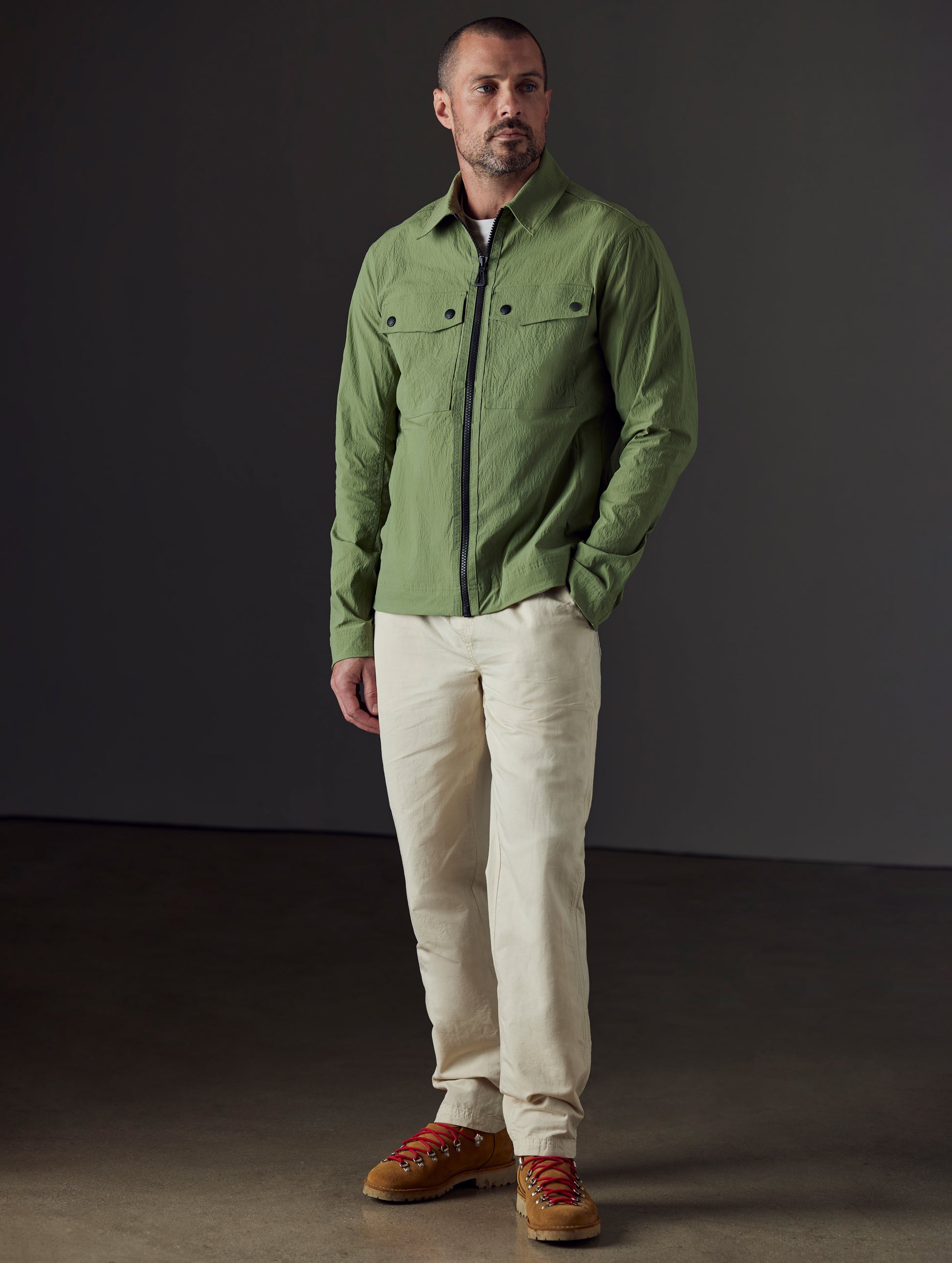 Front 3/4 full-body view of man wearing Highland Drawstring Pant in Bone White from AETHER Apparel.