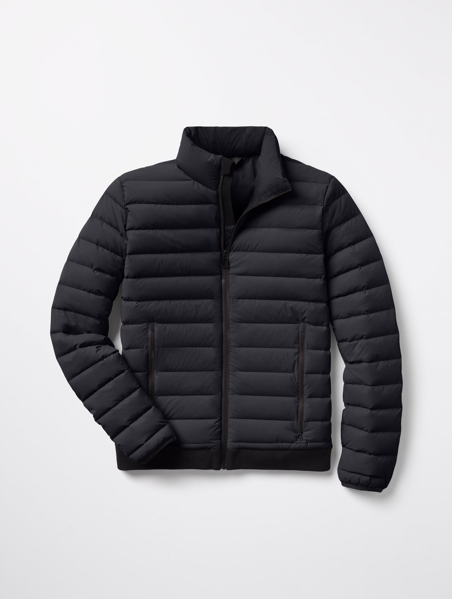 Flat lay of Launch Full-Zip Jacket NH in Onyx Black from AETHER Apparel.