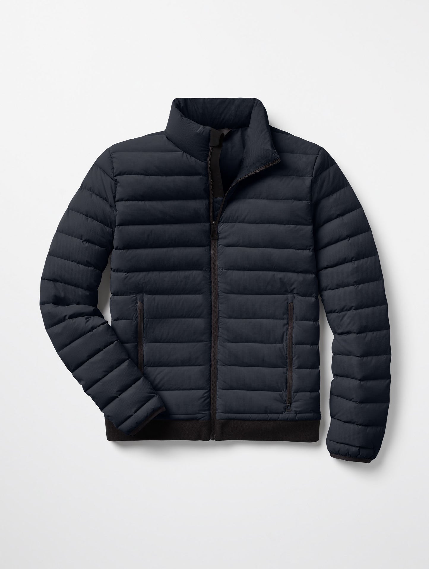 Flat lay of Launch Jacket in Onyx Black from AETHER Apparel.