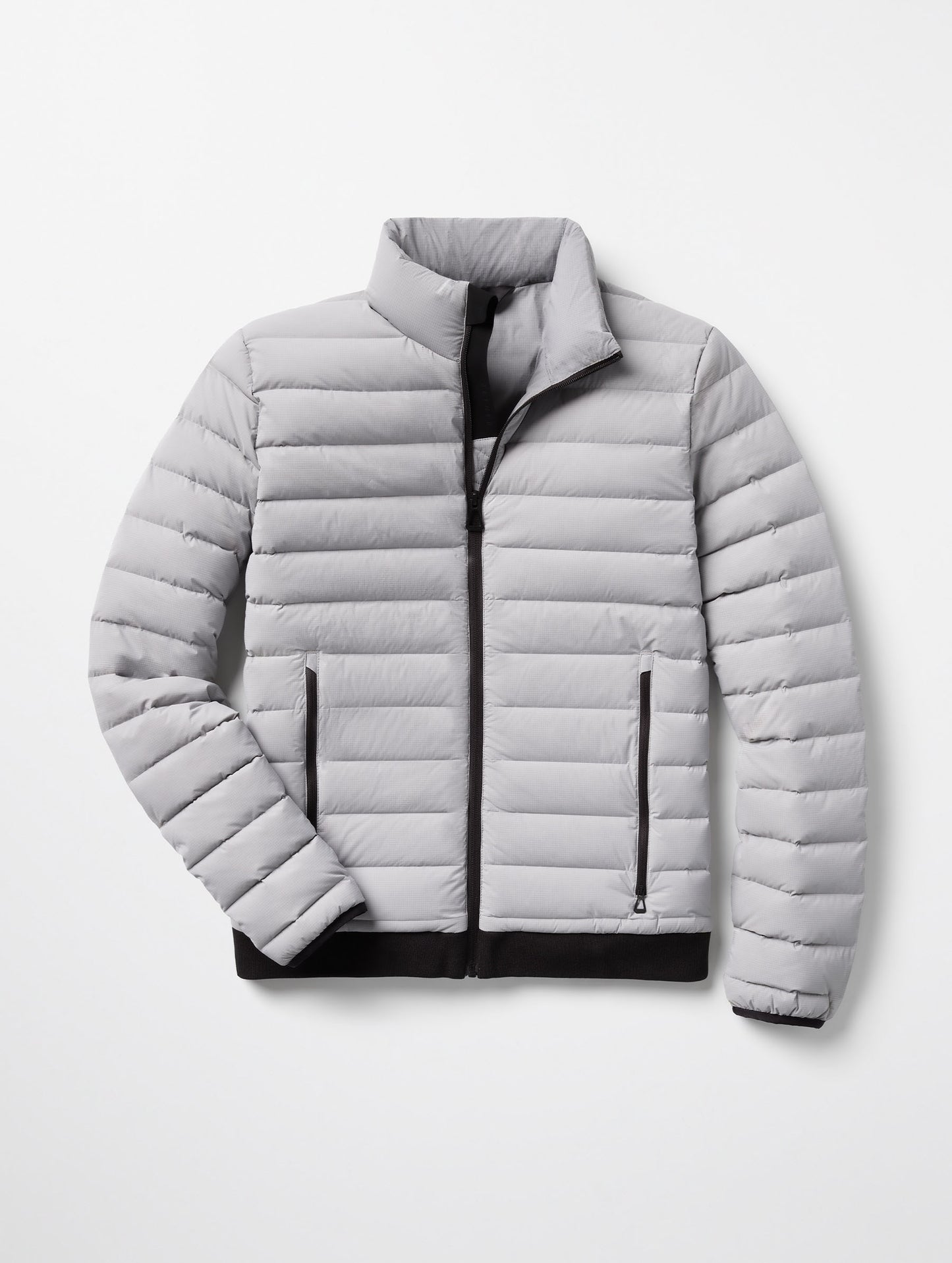 Flat lay of Launch Jacket in Sky Grey from AETHER Apparel.