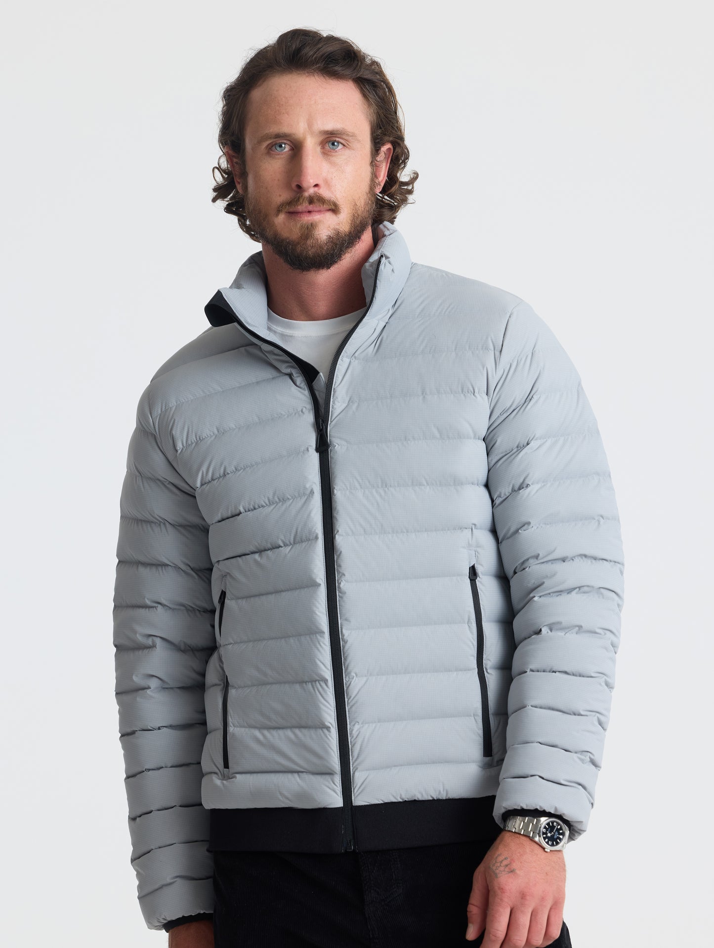 Front view of man wearing Launch Jacket in Sky Grey from AETHER Apparel.