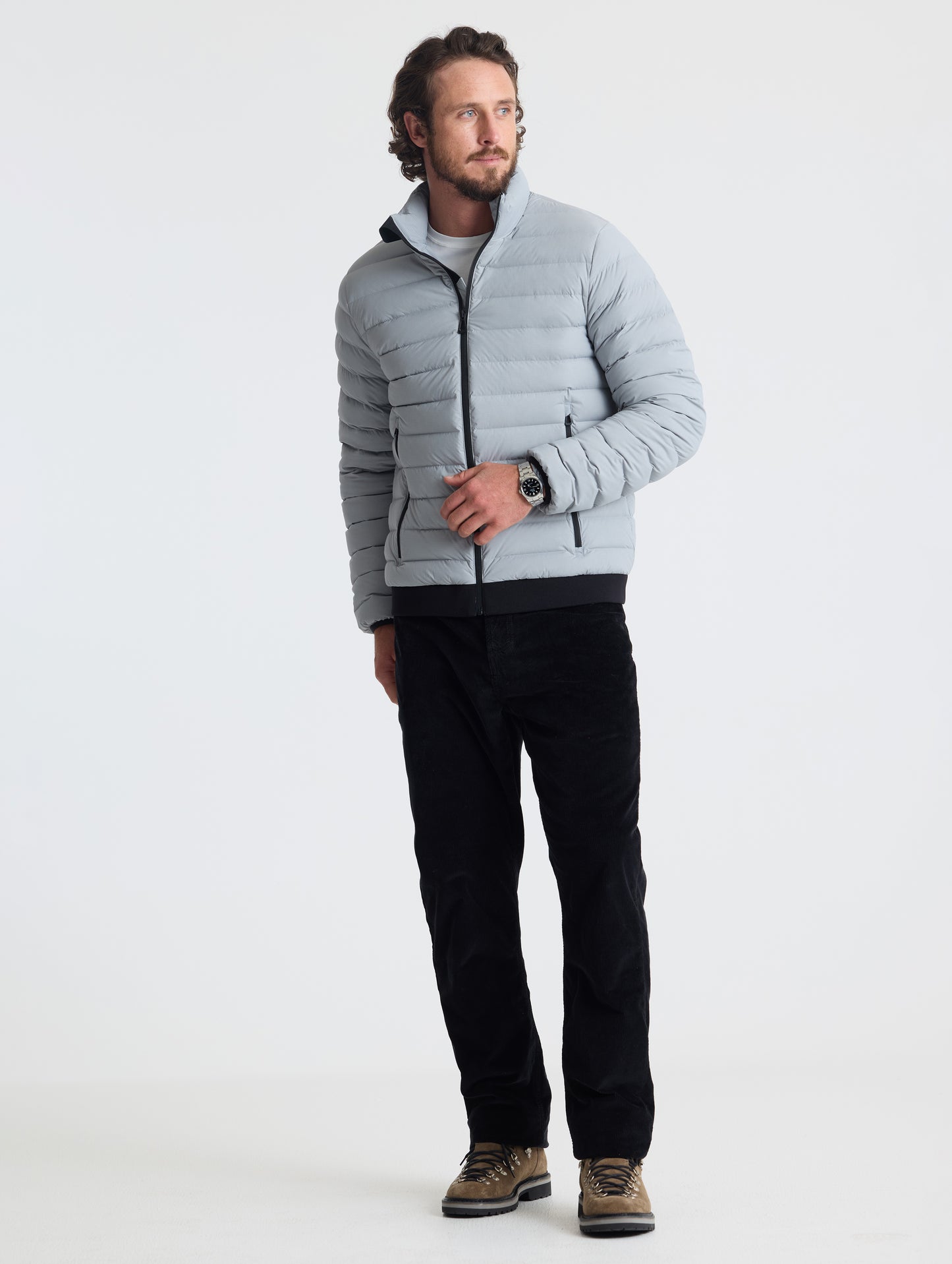 Full body view of man wearing Launch Jacket in Sky Grey from AETHER Apparel.