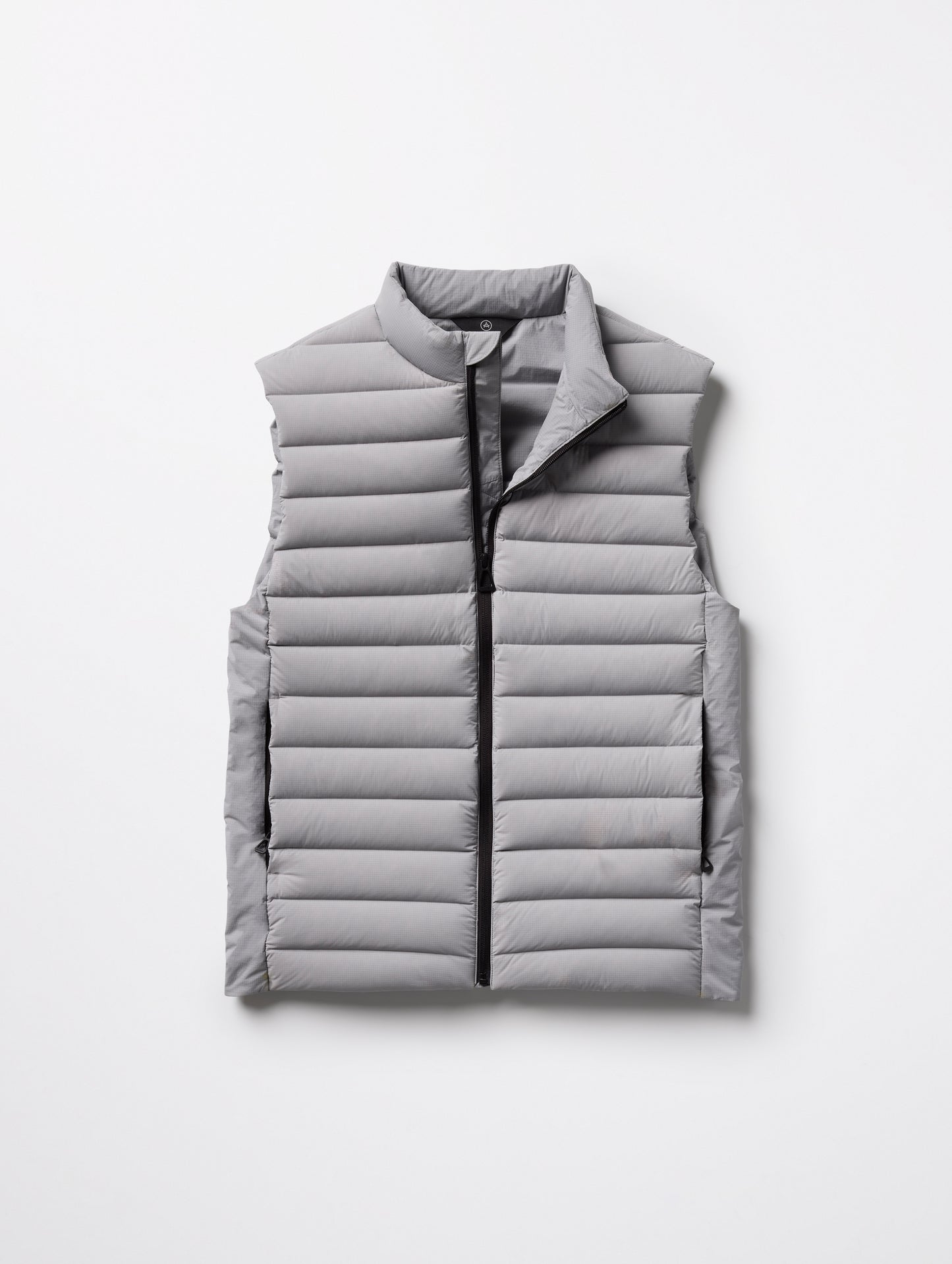 Flat lay of Launch Vest in Sky Grey from AETHER Apparel.