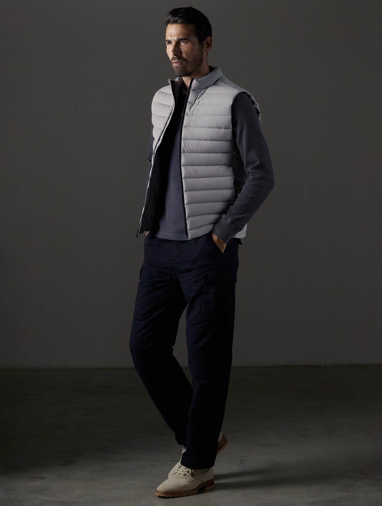 Front 3/4 full-body view of man wearing Launch Vest in Sky Grey from AETHER Apparel.