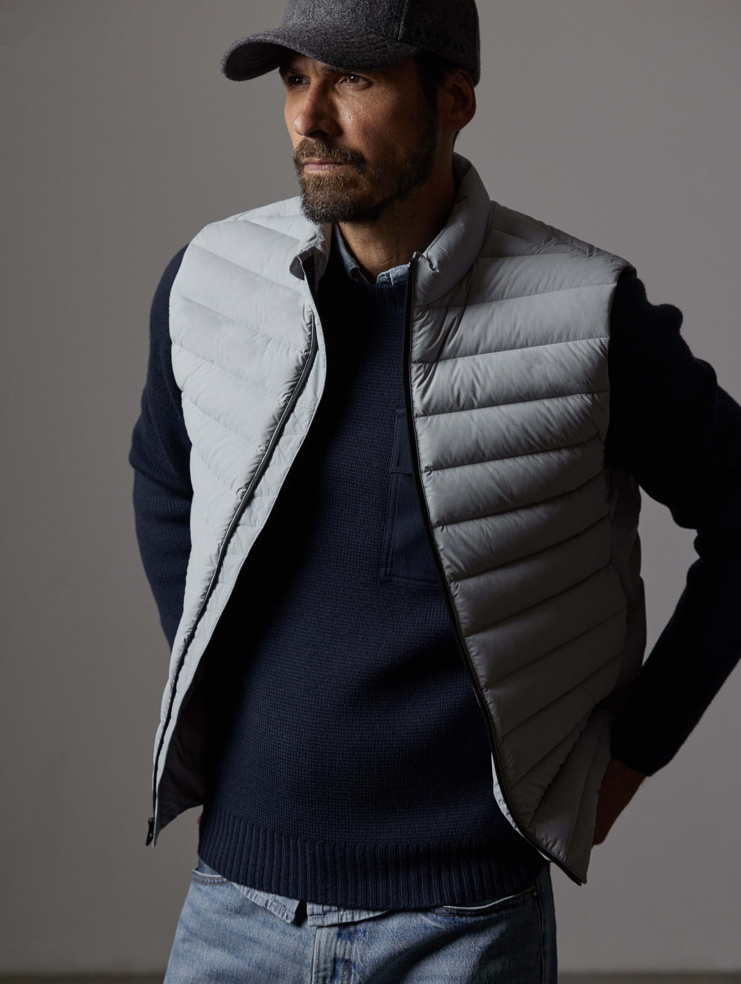 Front 3/4 body view of man wearing Launch Vest in Sky Grey from AETHER Apparel.