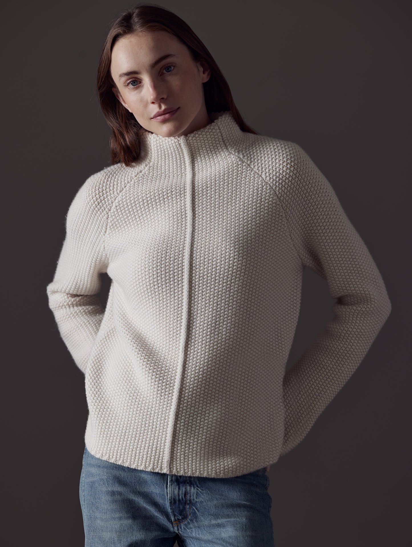 Front view of woman wearing Luxe Seamed Sweater in Winter White from AETHER Apparel.