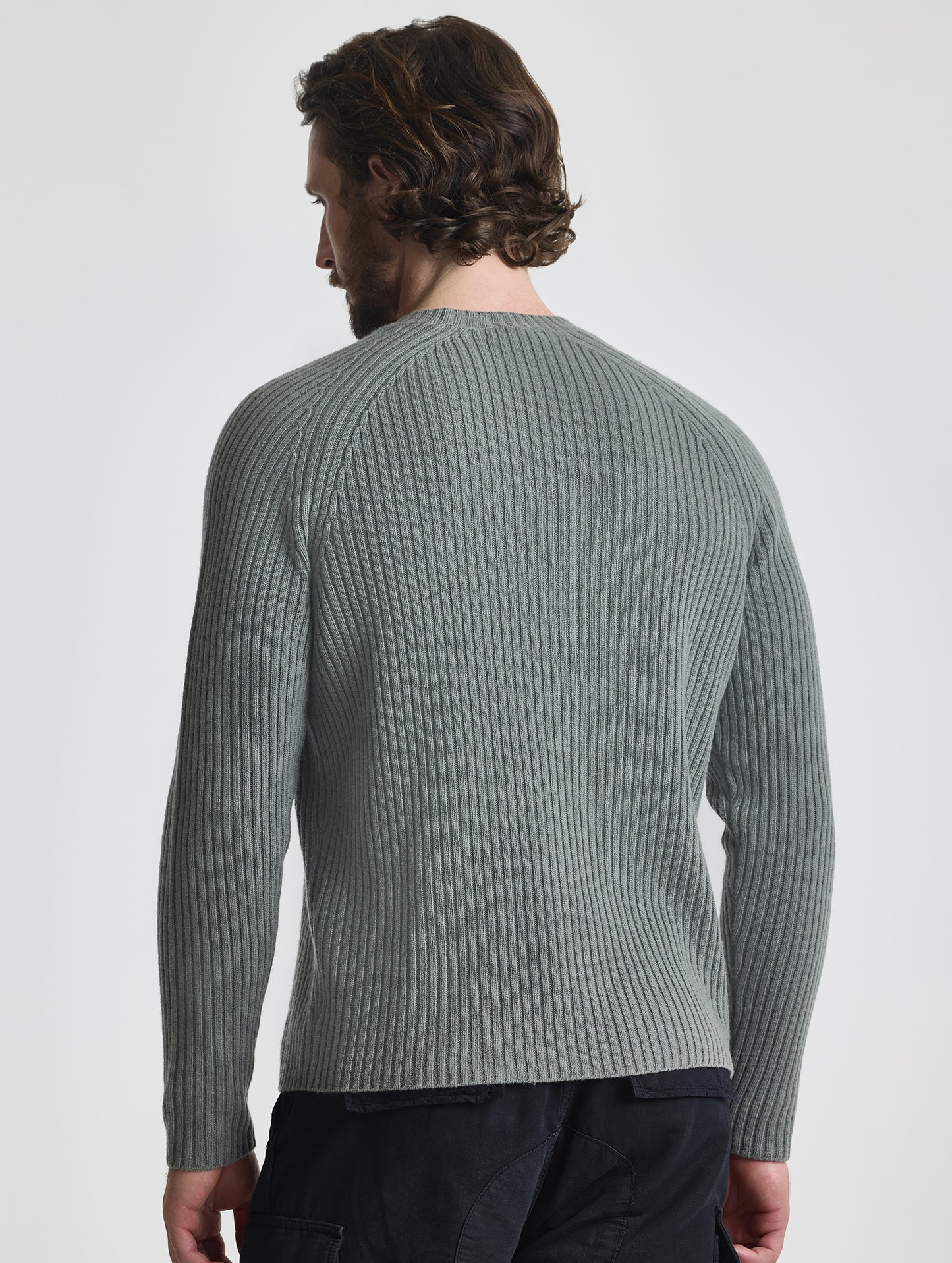 Rear view of man wearing Lyon Sweater in Gunmetal grey from AETHER Apparel.