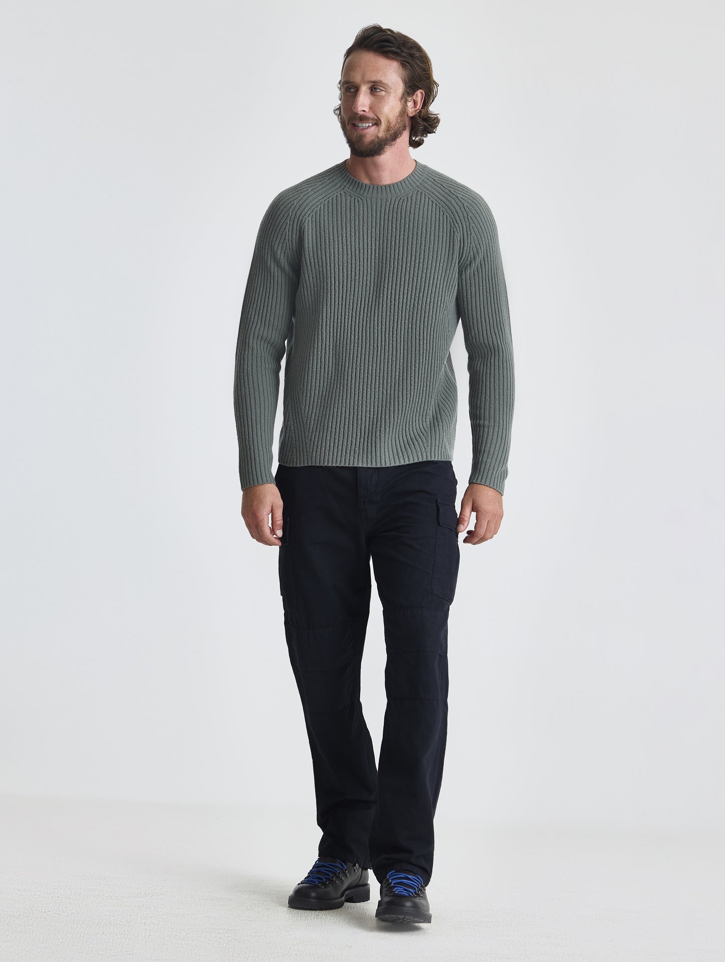 Full body view of man wearing Lyon Sweater in Gunmetal grey from AETHER Apparel.