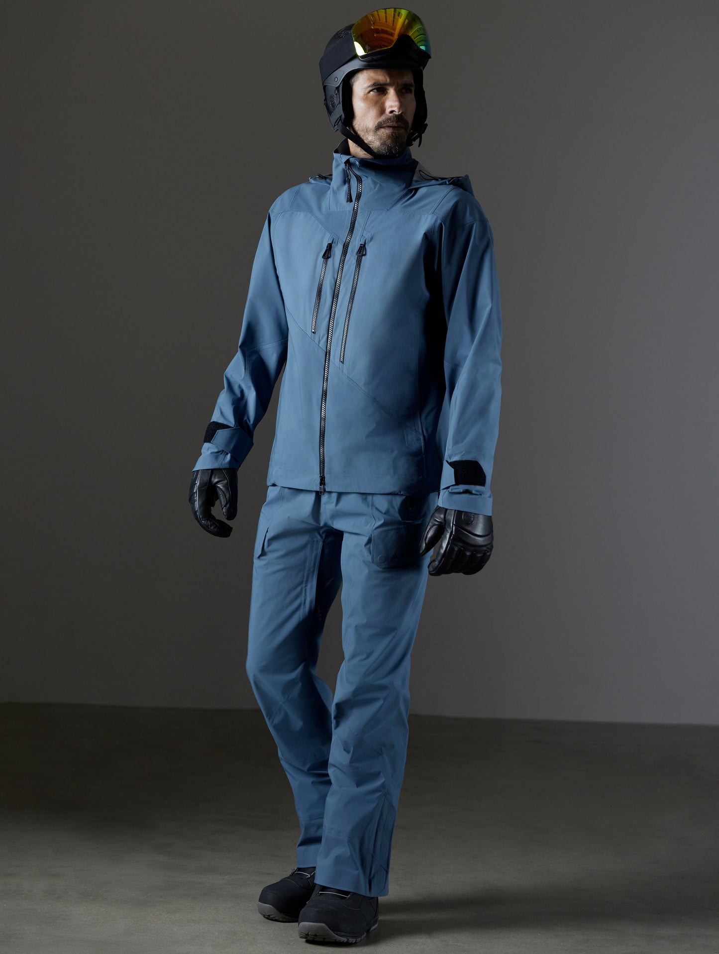 Front 3/4 full-body view of man wearing Maverick Snow-Shell Jacket and Maverick Snow-Shell Pant in Portal Blue from AETHER Apparel.