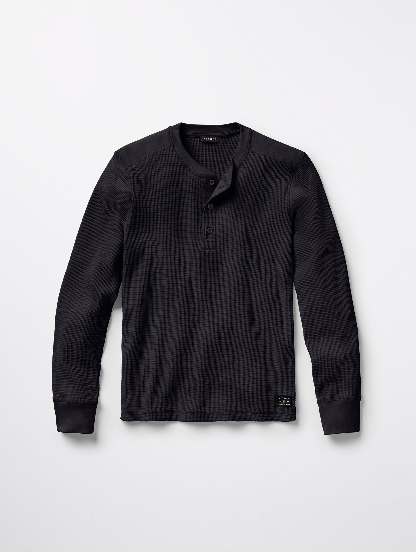 Flat lay of Milford Waffle Henley in Onyx Black from AETHER Apparel.