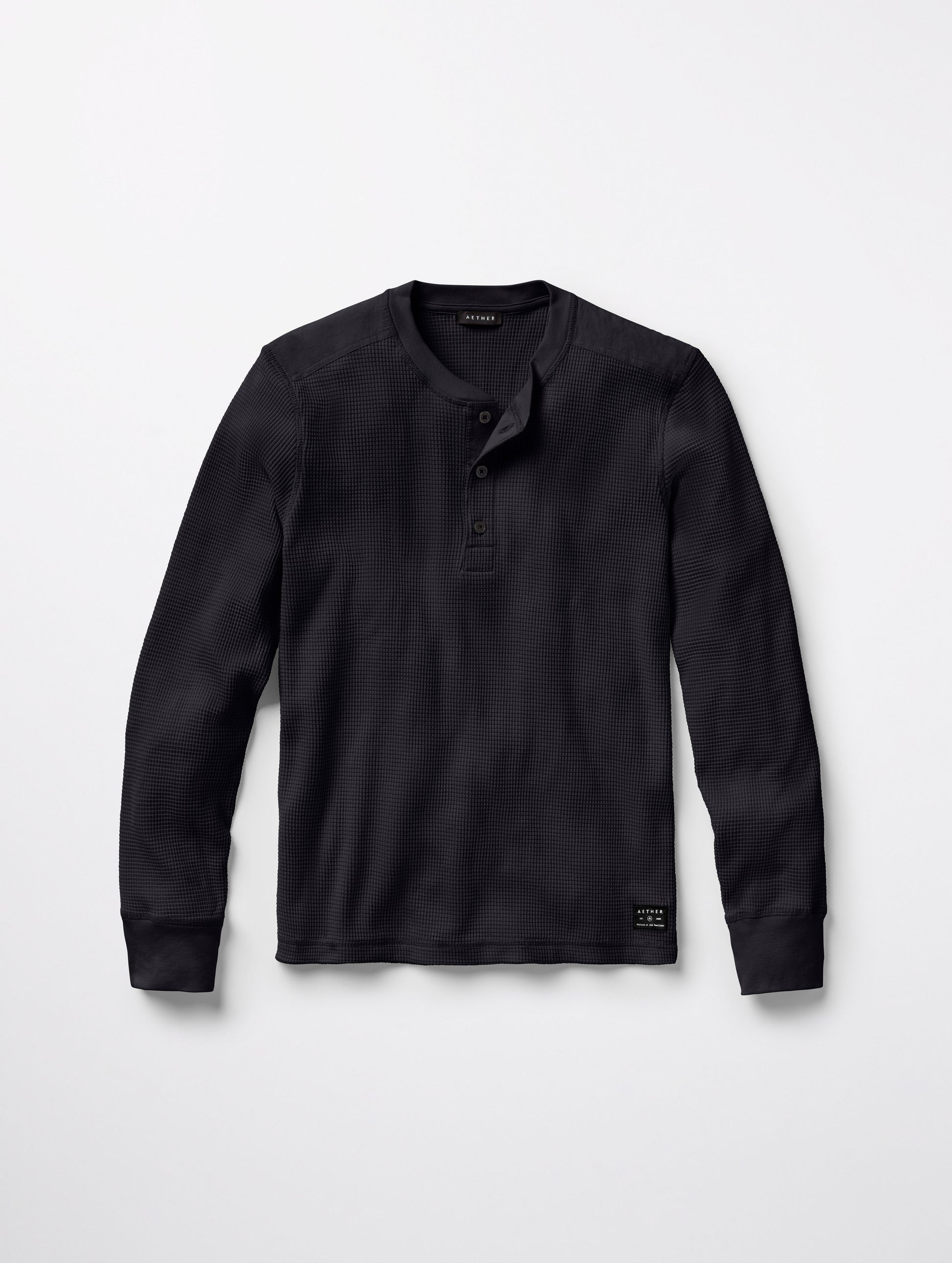 Flat lay of Milford Waffle Henley in Onyx Black from AETHER Apparel.