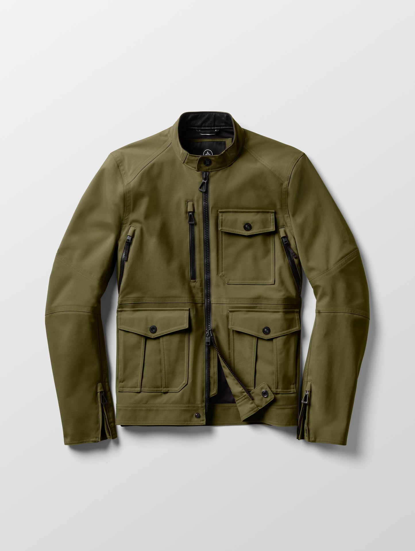 Flat lay of Mulholland Motorcycle Jacket in Command Green from AETHER Apparel.