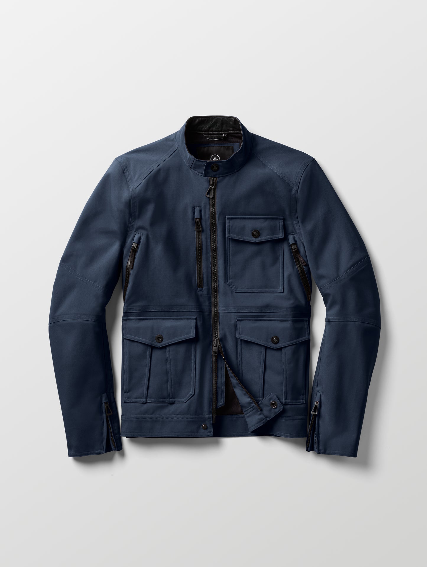 Flat lay of Mulholland Motorcycle Jacket in Total Eclipse dark blue from AETHER Apparel.