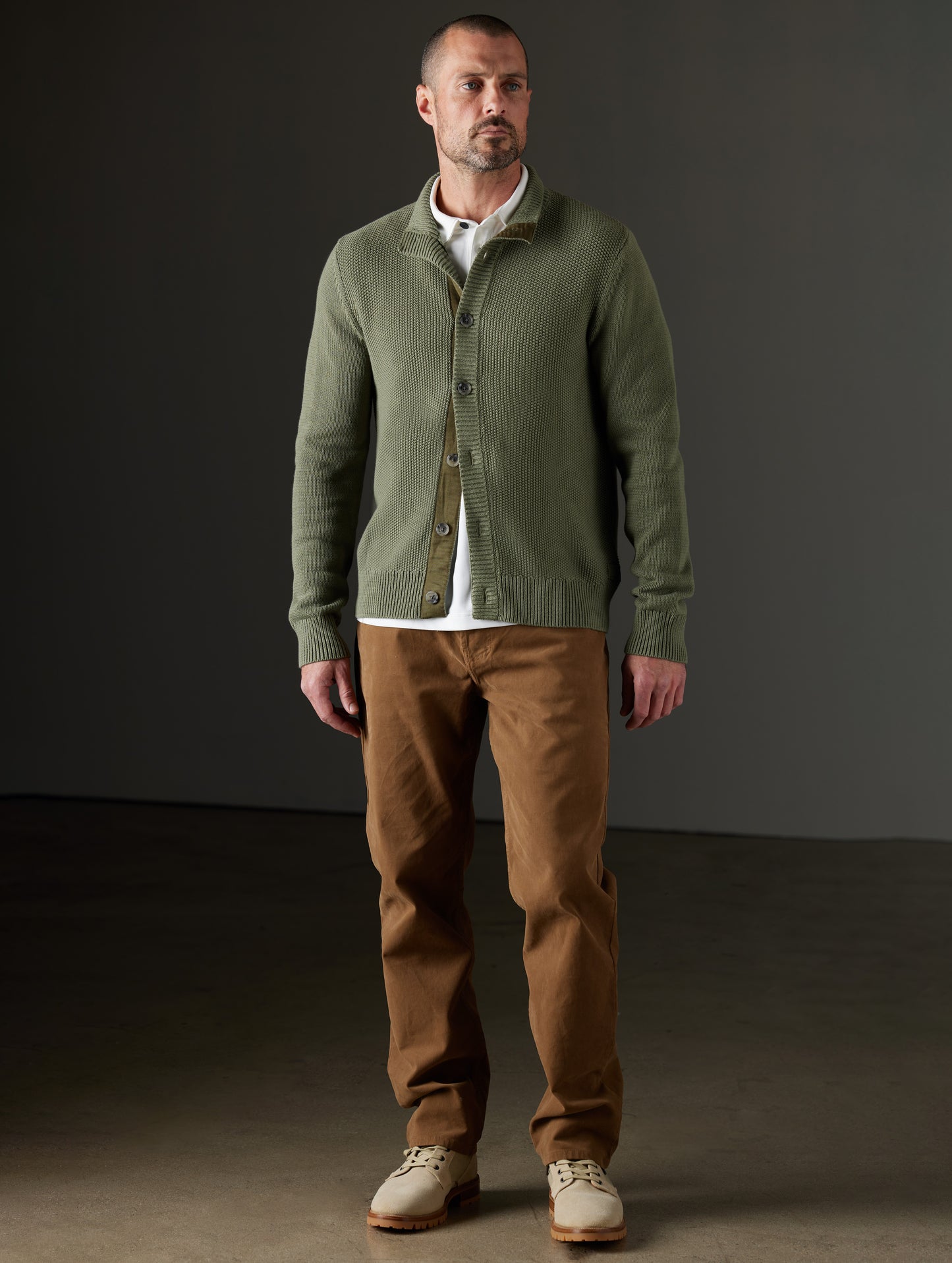 Front full-body view of man wearing Oliver Cotton Button-Up Sweater in Fern Green from AETHER Apparel.