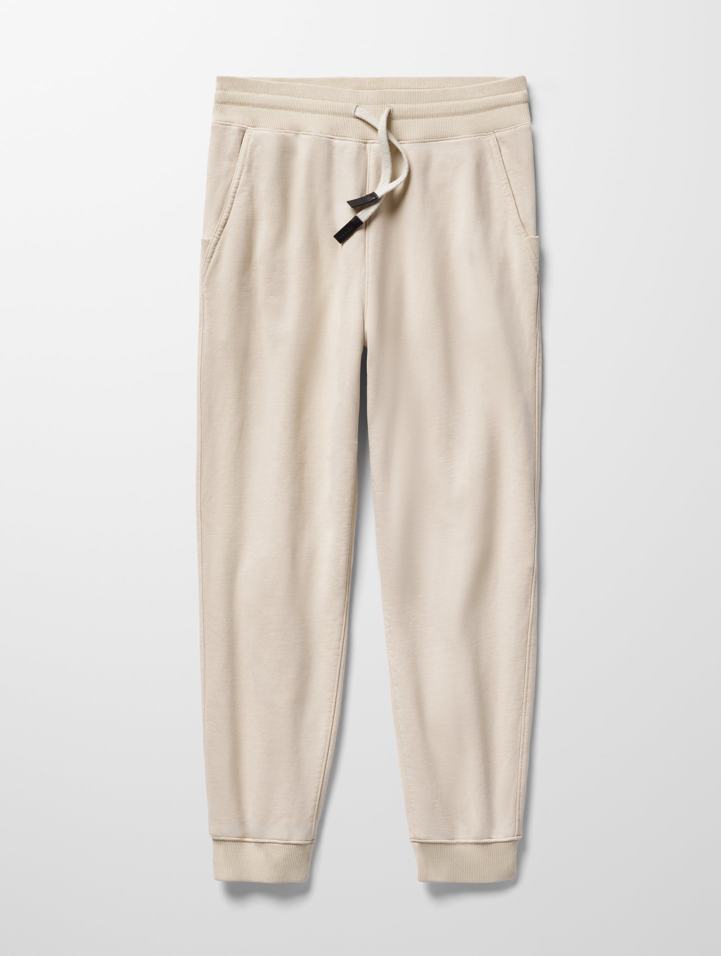 Flay lay image of Osa Cuffed Sweatpant in Bone white from AETHER Apparel.