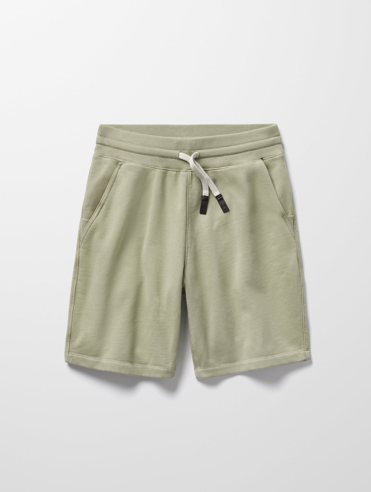 Flat lay of Osa Sweatshort in Sage Green from AETHER Apparel.