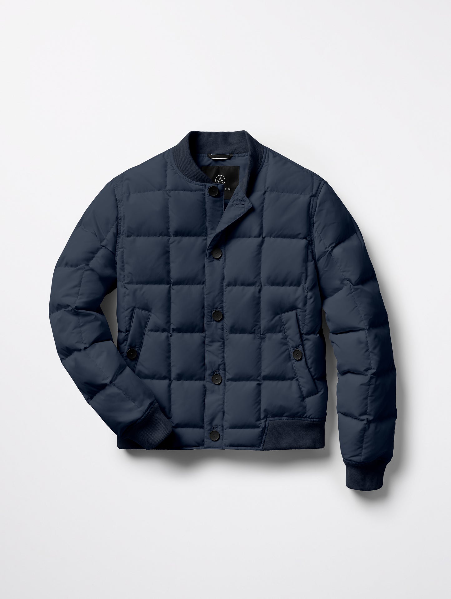 Flat lay of Pacer Jacket in Total Eclipse blue from AETHER Apparel.