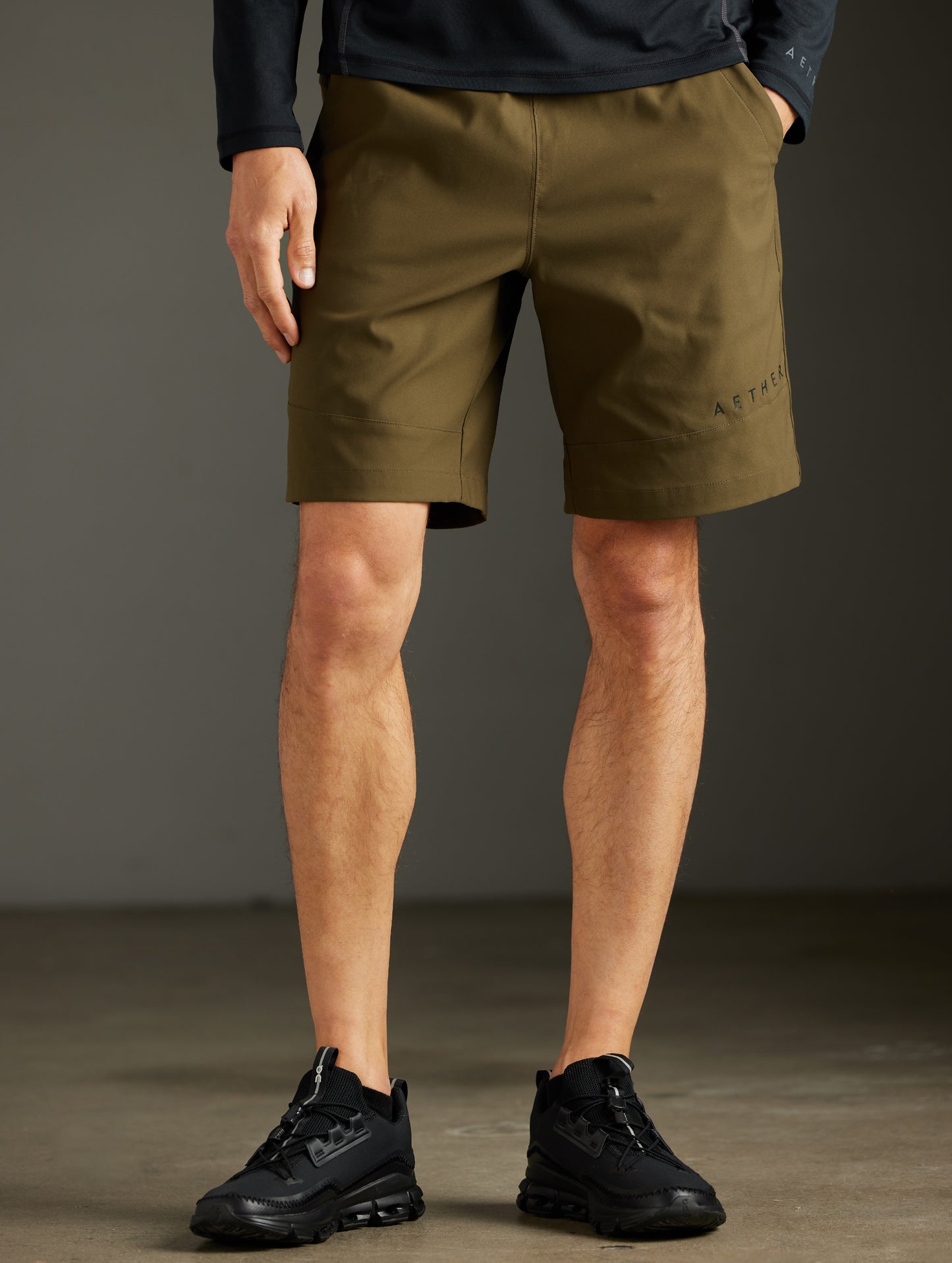 Front lower body view of man wearing Perth Short in Cadet Green from AETHER Apparel.