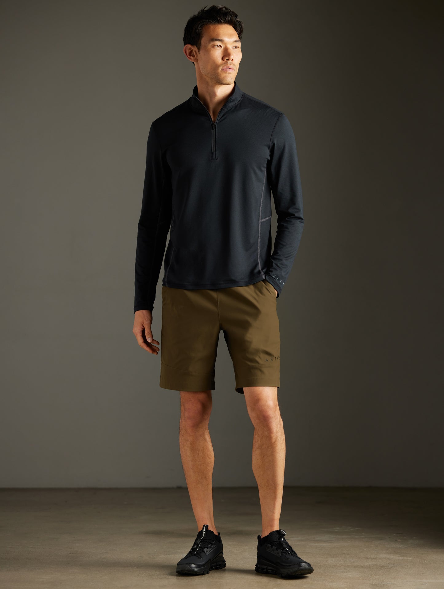 Front full-body view of man wearing Perth Short in Cadet Green from AETHER Apparel.