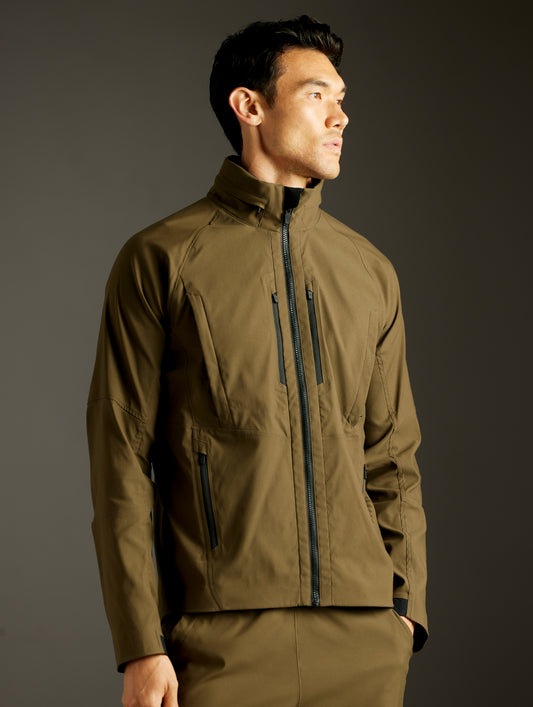 Front 3/4 body view of man wearing Perth Vented Jacket in Cadet Green from AETHER Apparel.