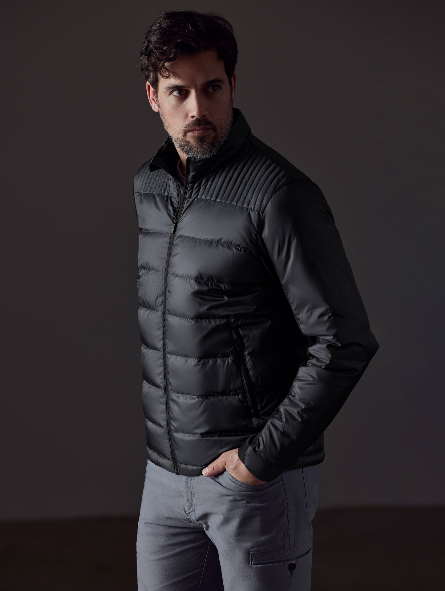 man wearing a black insulated jacket from AETHER Apparel