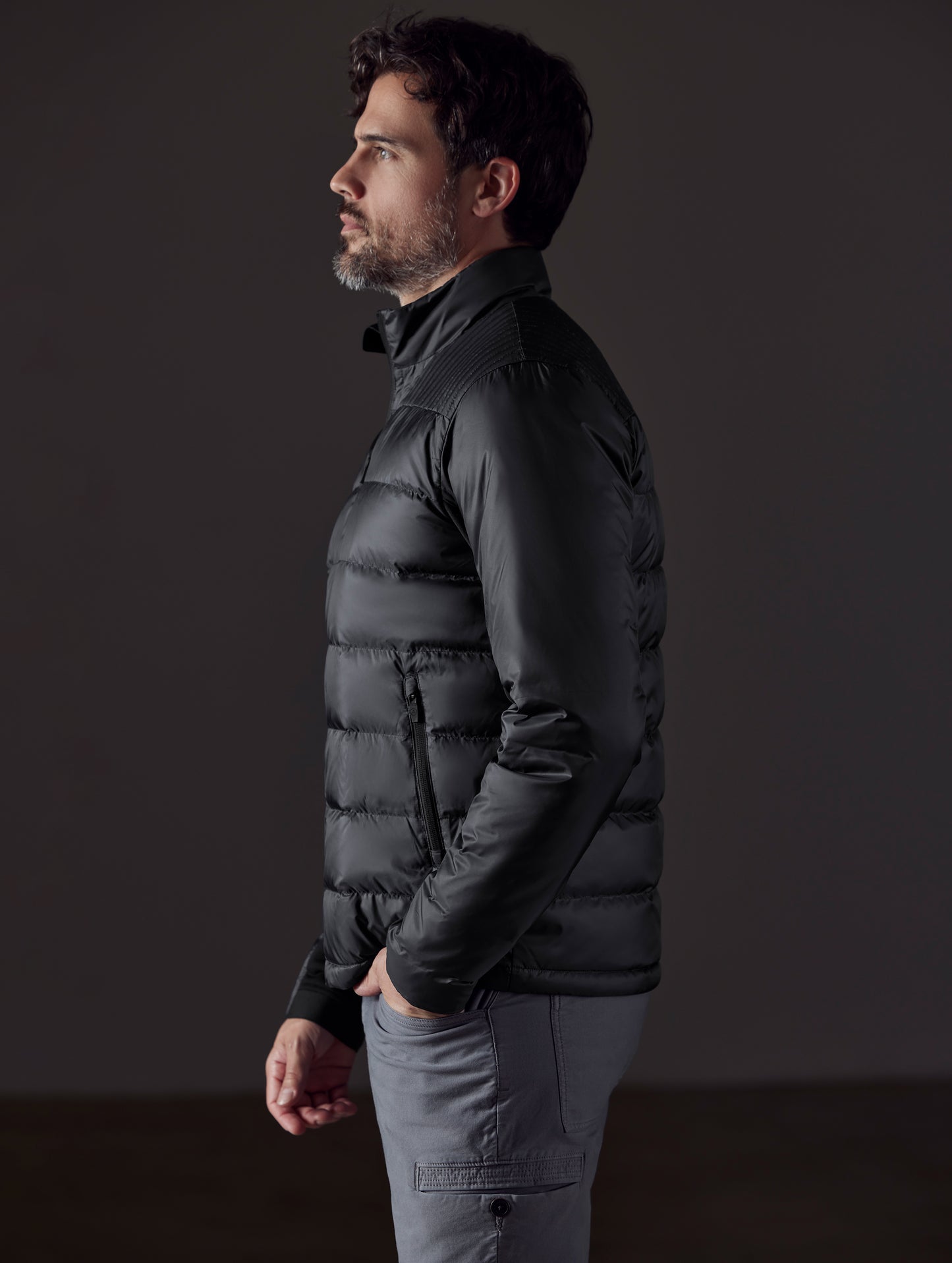 man wearing a black insulated jacket from AETHER Apparel