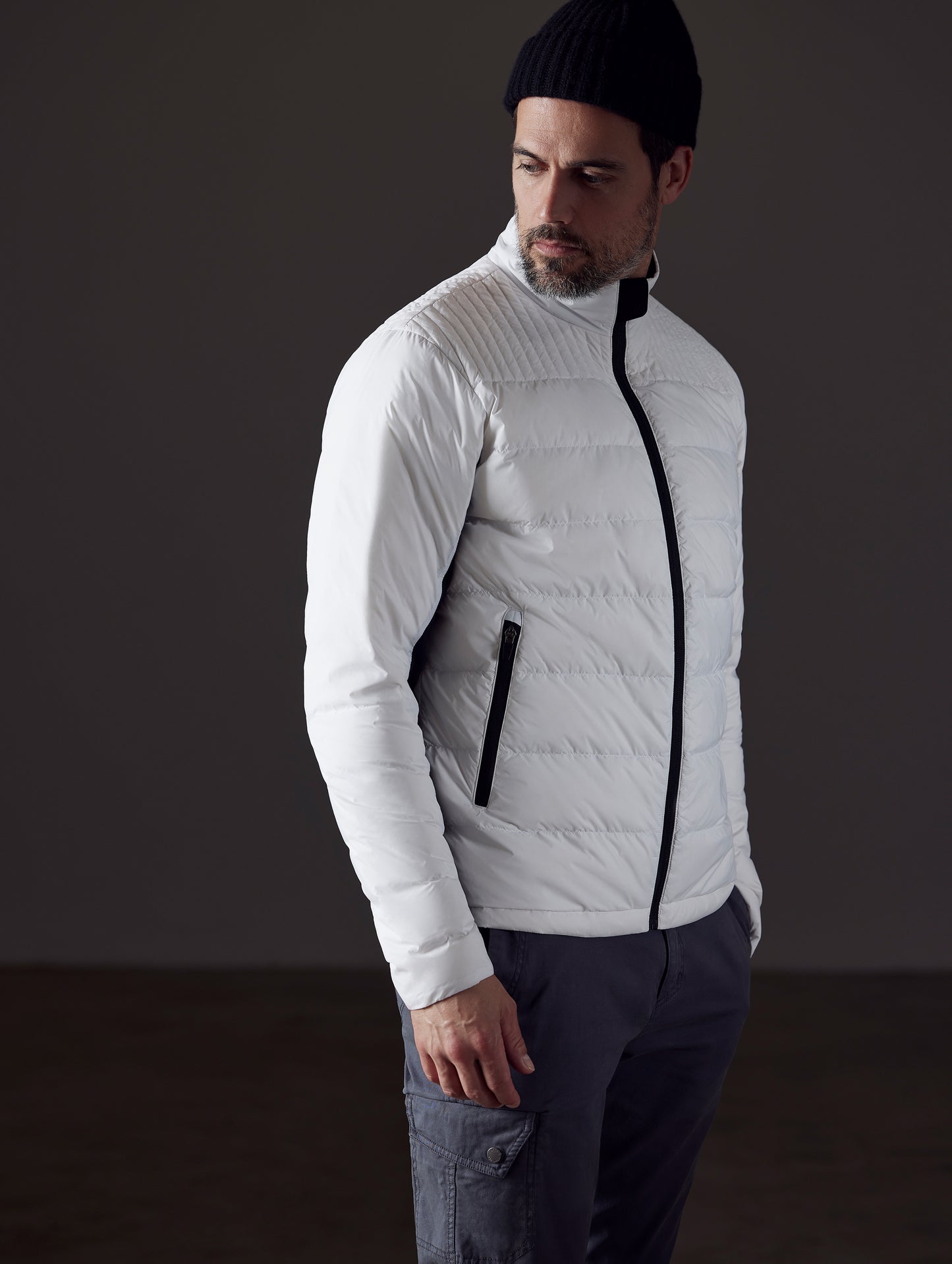 man wearing a white insulated jacket from AETHER Apparel
