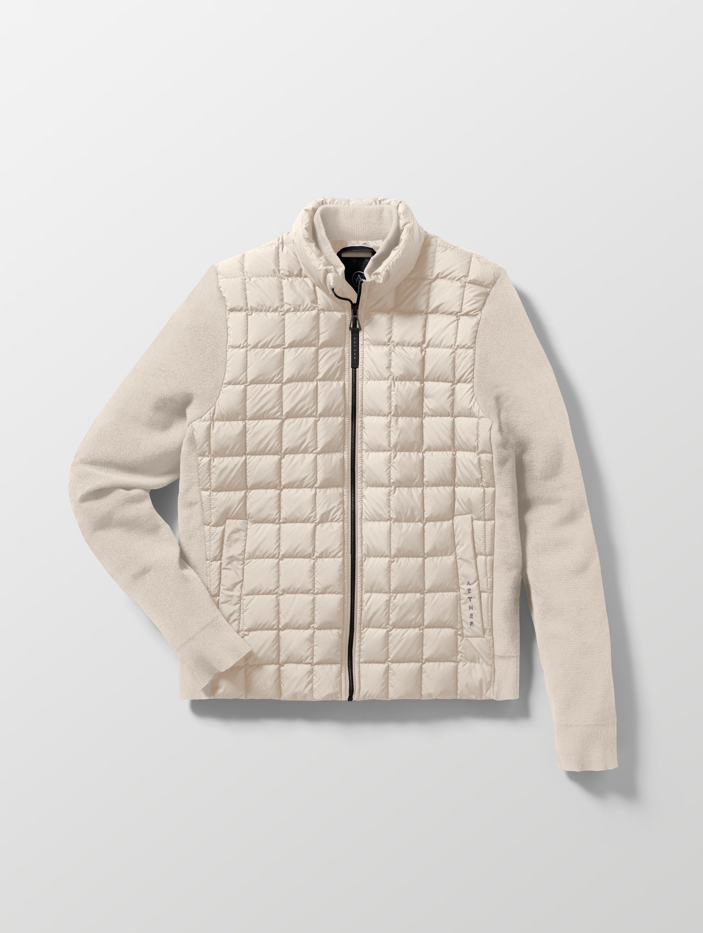 Flat lay of the M Phase Full-Zip in Bone white from AETHER Apparel.