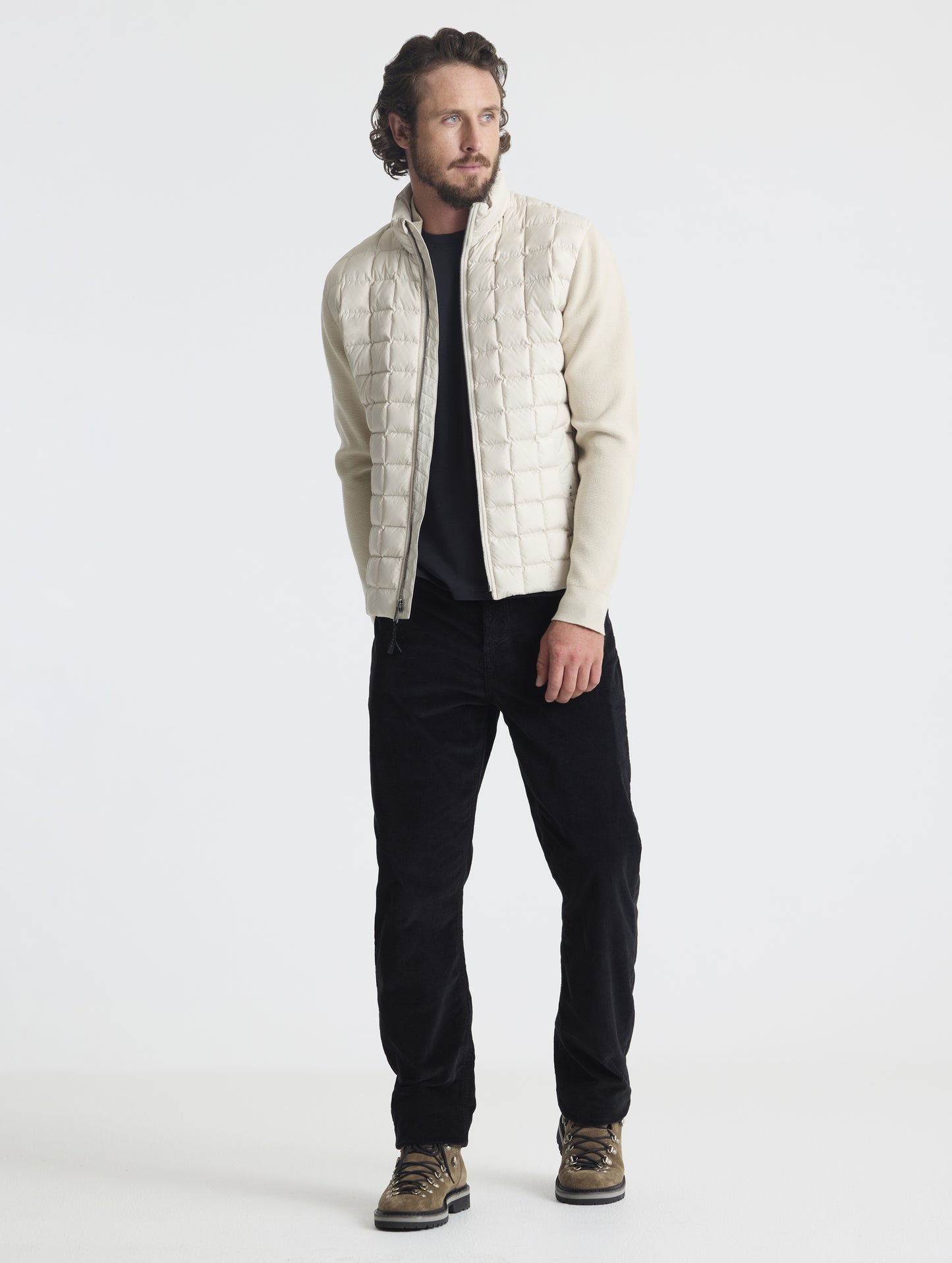 Front full-body view of man wearing zipped-up M Phase Full-Zip in Bone white from AETHER Apparel.