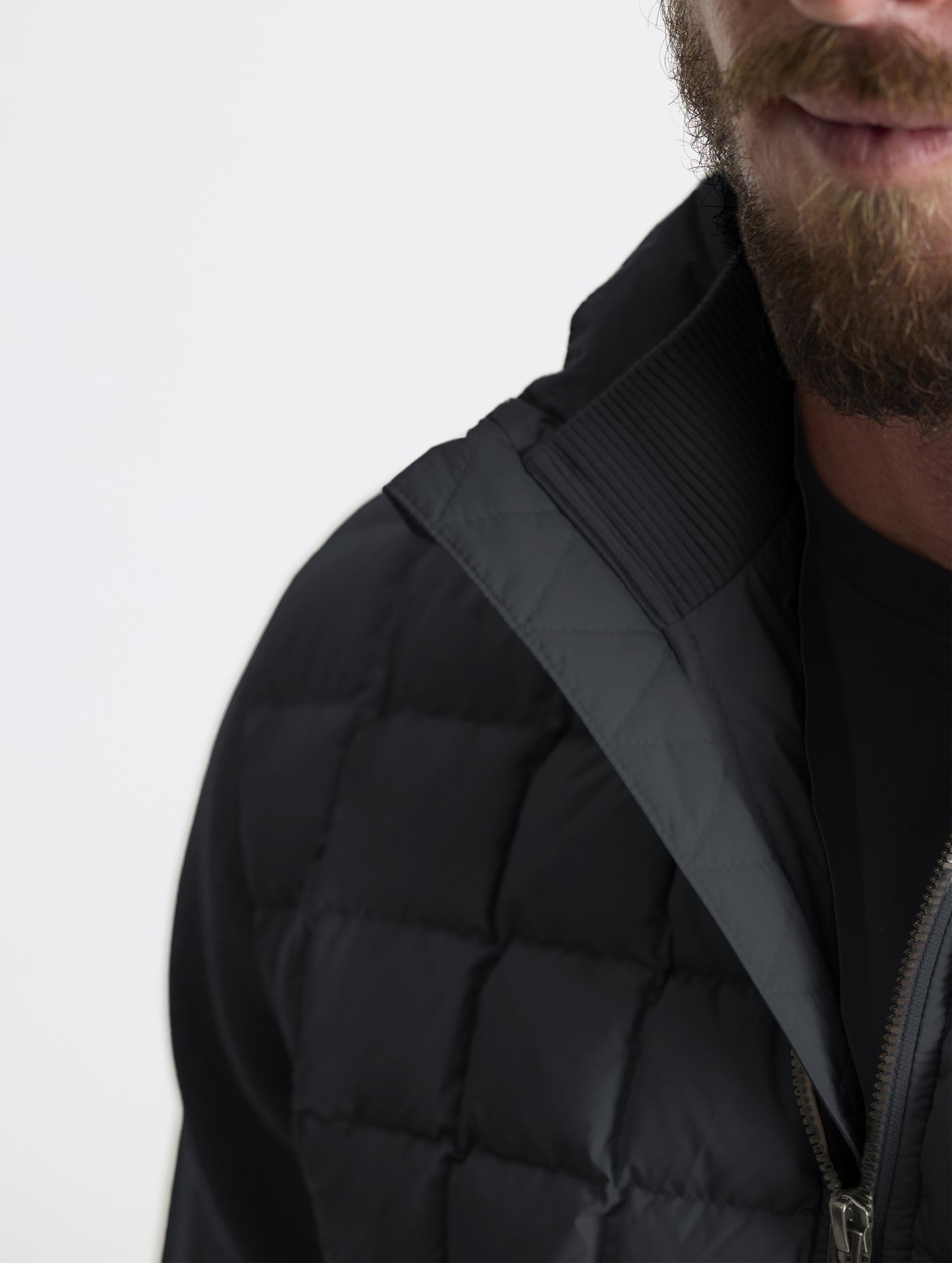 Closeup detailed view of the cotton-and-cashmere blend 2x2 rib knit interior collar on the M Phase Full-Zip in Onyx Black from AETHER Apparel.