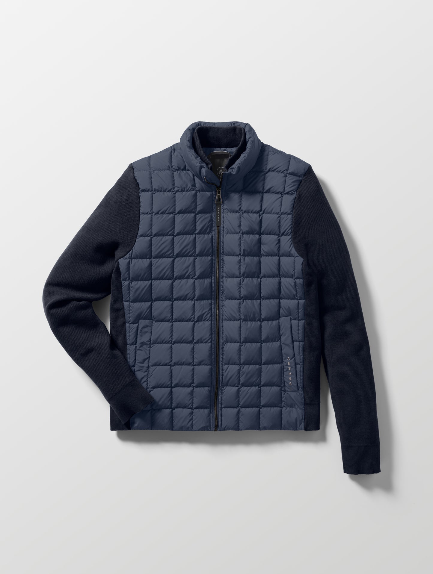 Flat lay of the M Phase Full-Zip in Total Eclipse dark blue from AETHER Apparel.