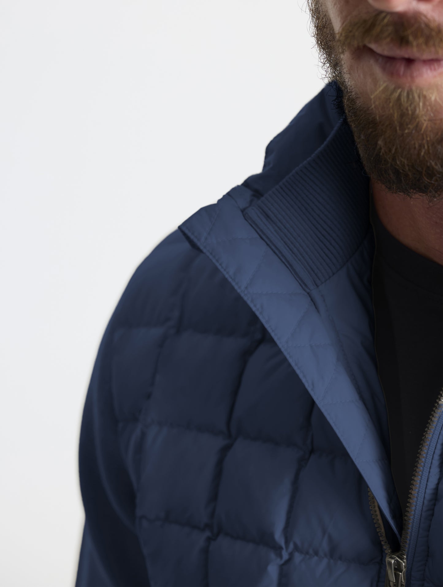 Closeup detailed view of the cotton-and-cashmere blend 2x2 rib knit interior collar on the M Phase Full-Zip in Total Eclipse dark blue from AETHER Apparel.