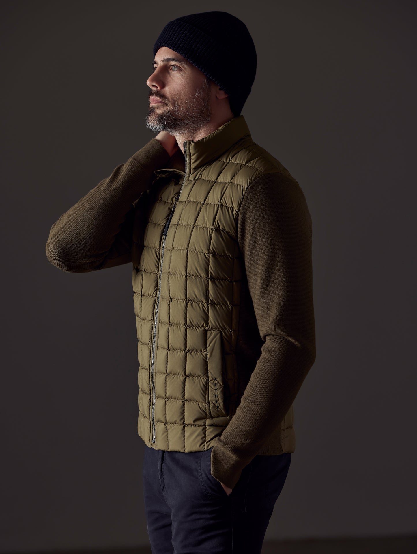 man wearing green insulated jacket from AETHER Apparel