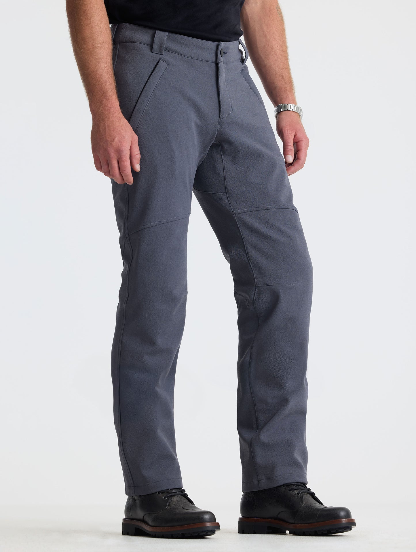Front 3/4 lower-body view of man wearing Ramble Pant 3.0 in Graphite from AETHER Apparel.