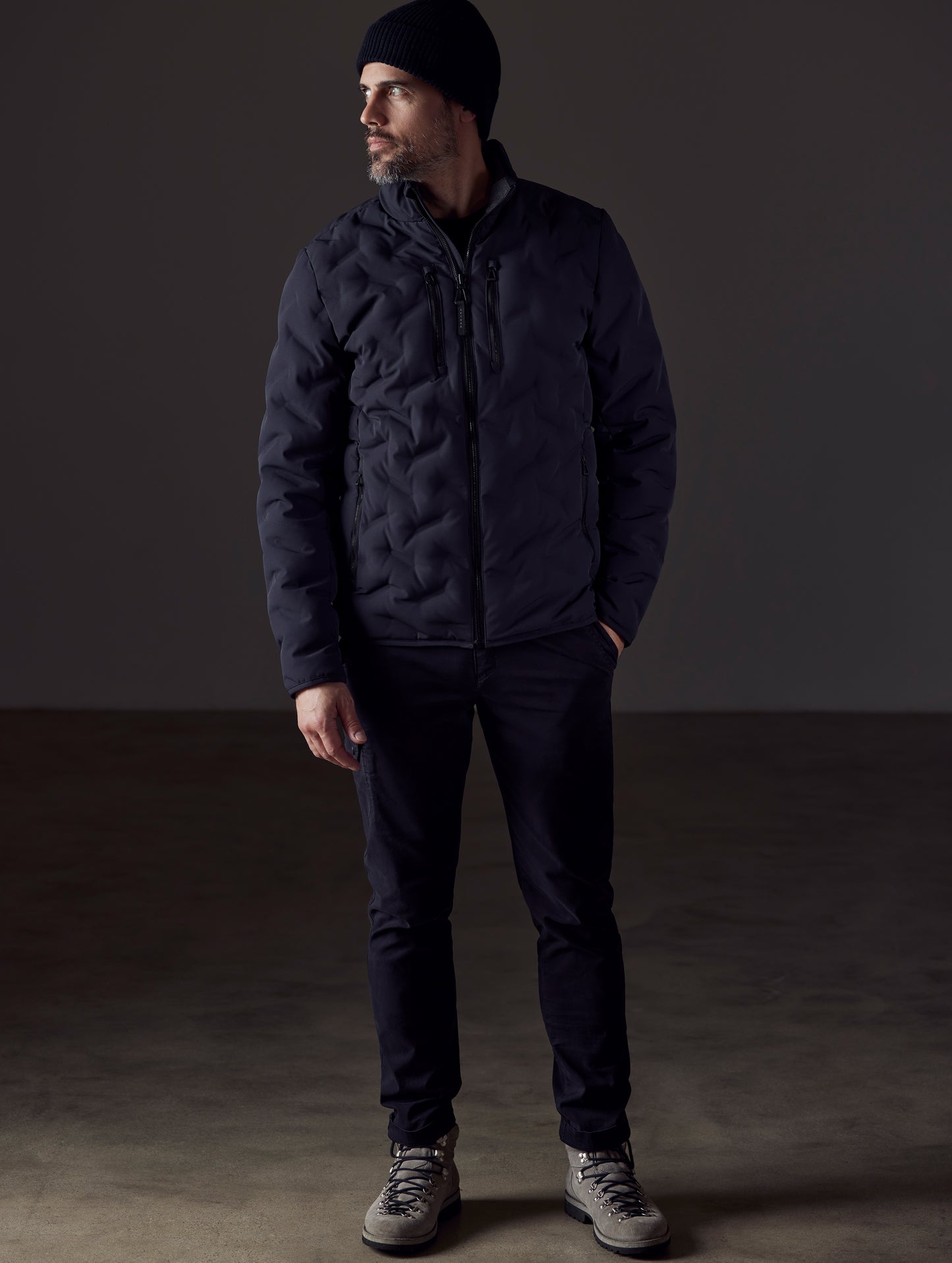Man wearing black insulated jacket from AETHER Apparel