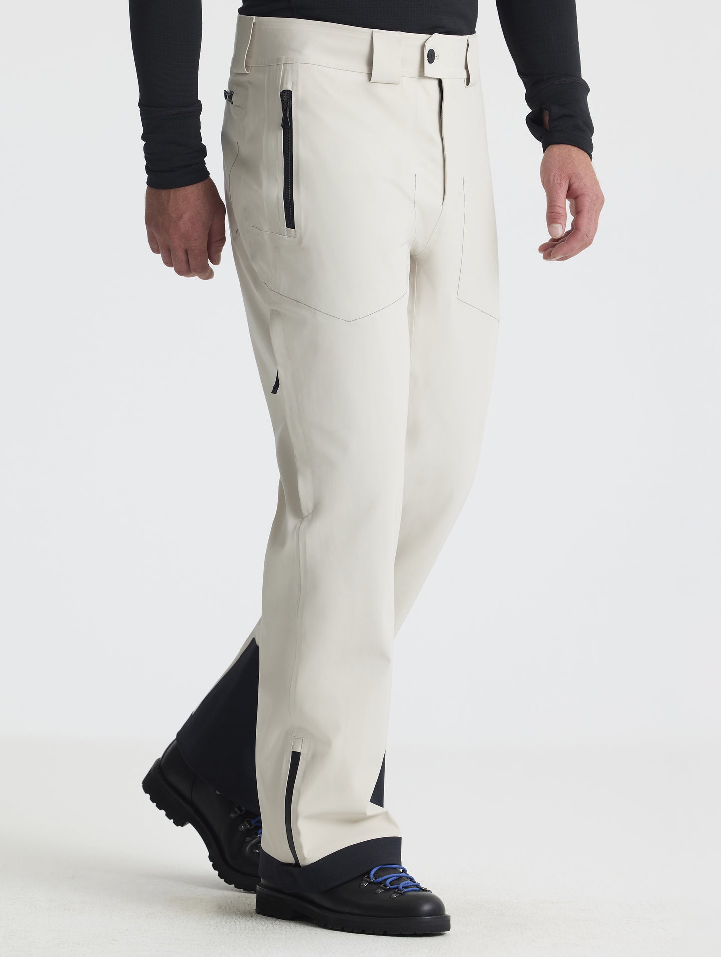Front angled lower-body view of man wearing the Ridge Insulated Snow Pant in Bone from AETHER Apparel.