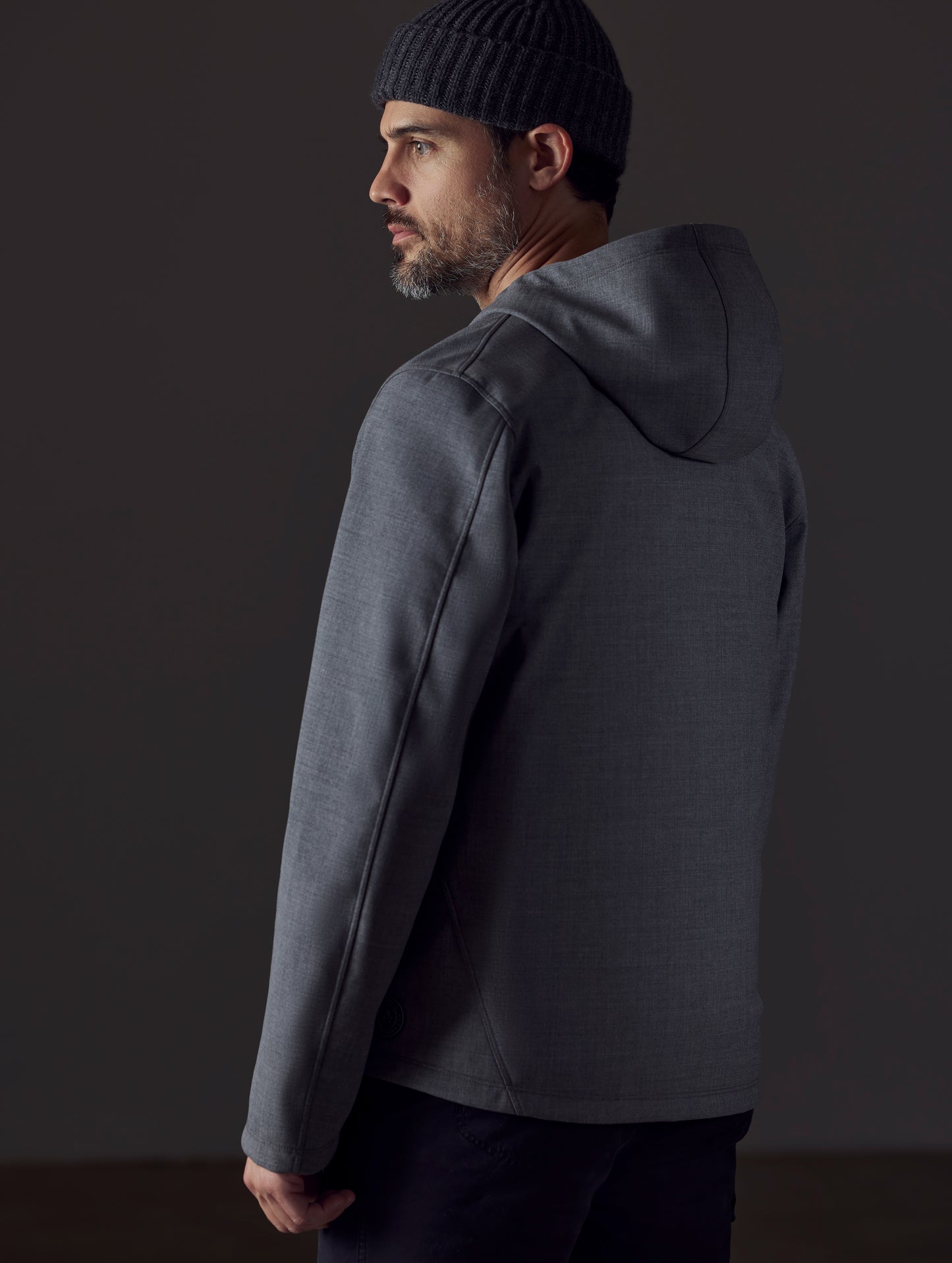 Man wearing grey technical jacket from AETHER Apparel