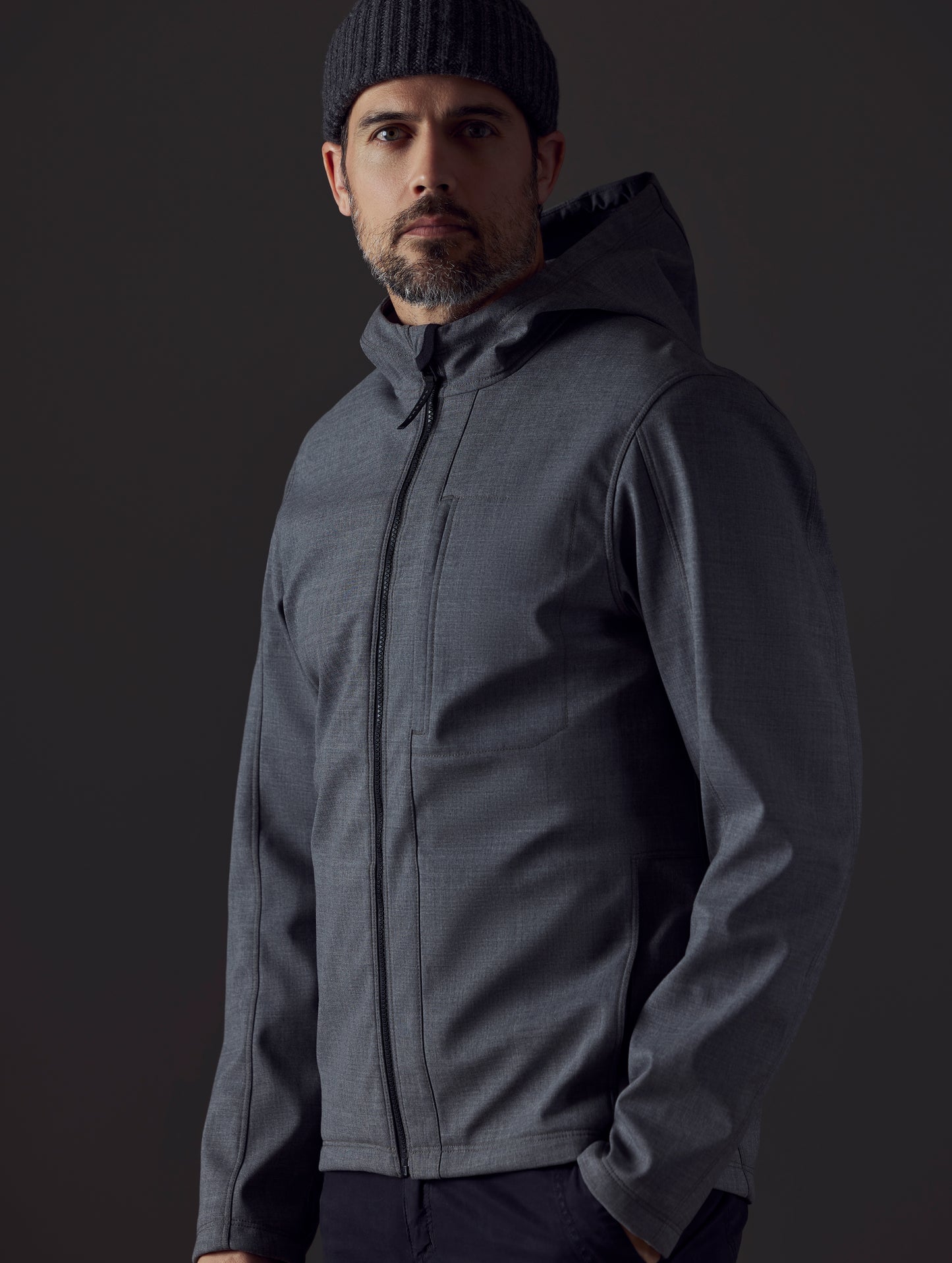 Man wearing grey technical jacket from AETHER Apparel