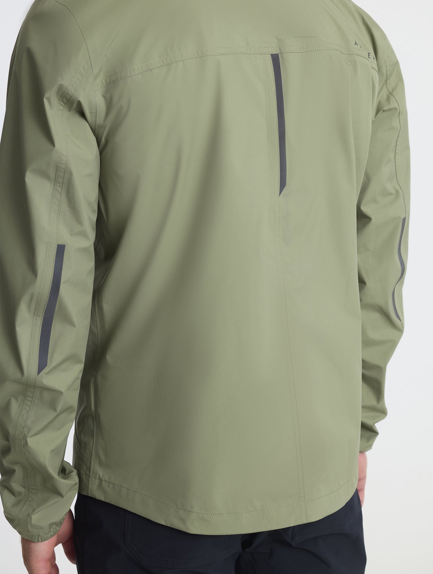 Closeup of rear self-packing zipper of Storm All-Weather Jacket in Fern Green from AETHER Apparel.