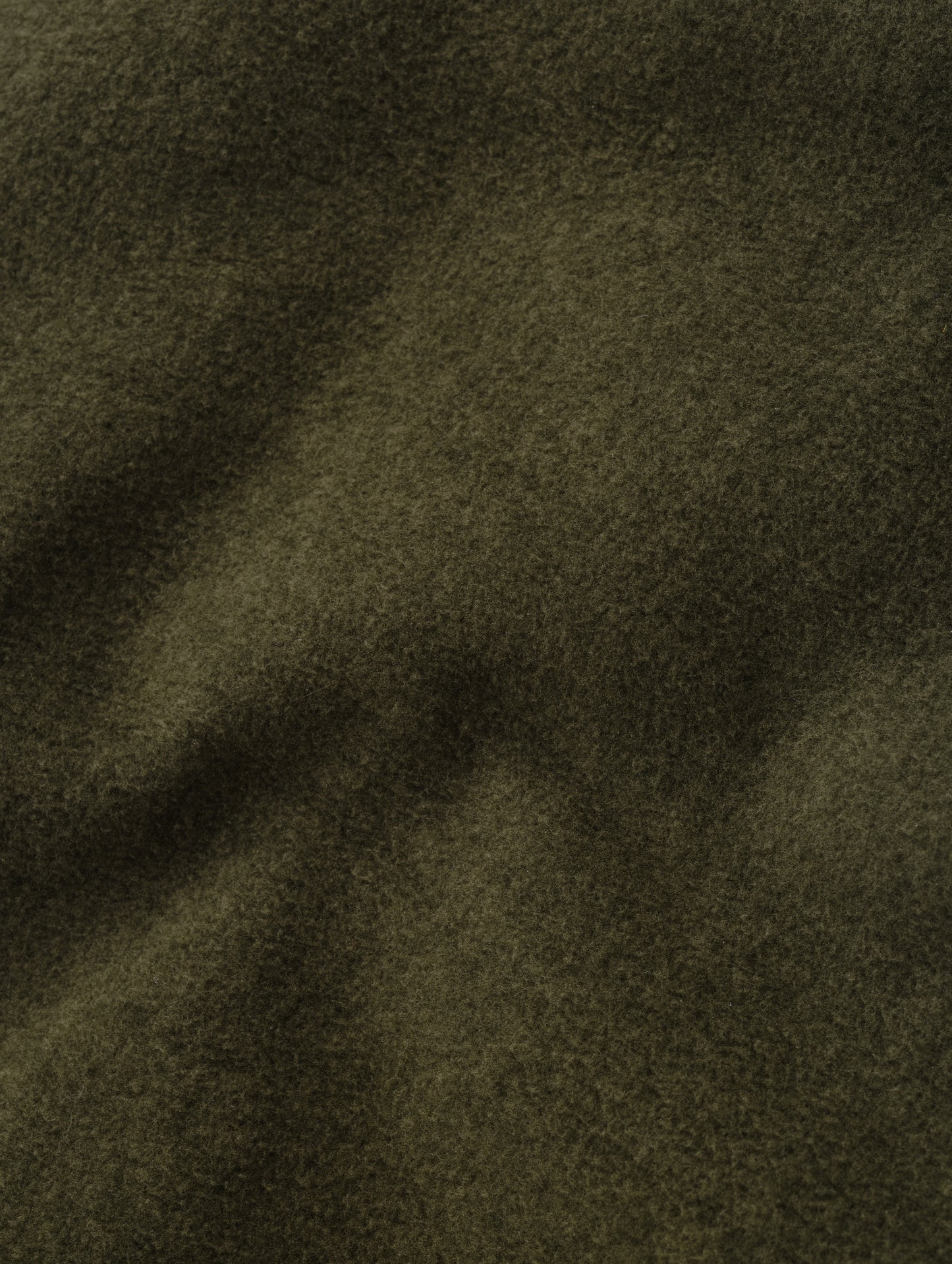 Closeup detailed view of the micro fleece construction on the Sutherlin Pant in Forest Green from AETHER Apparel.