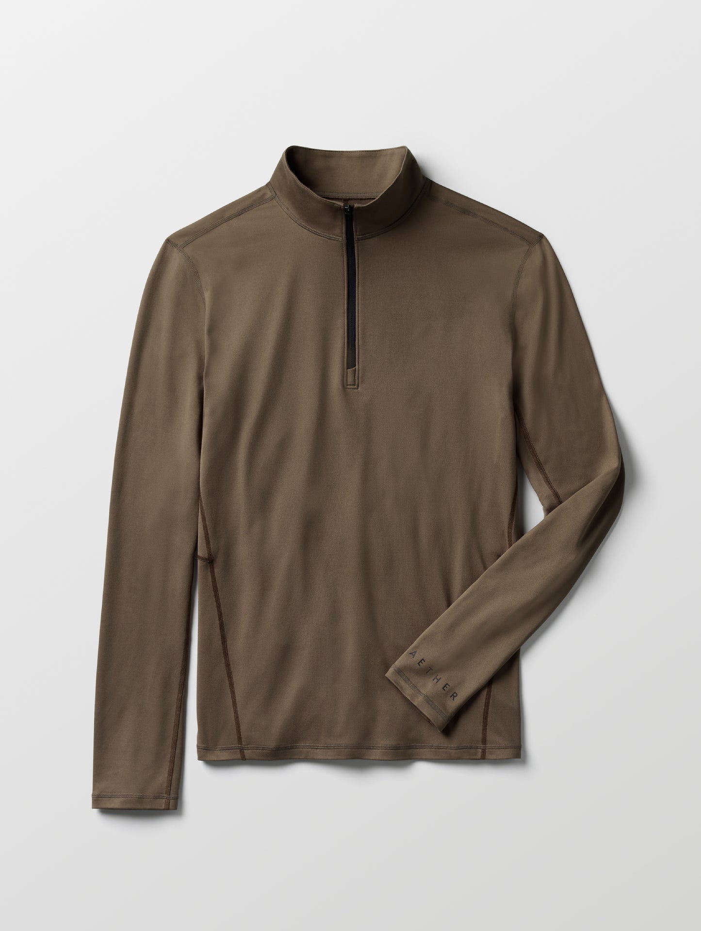 Flat lay of men's Trek Articulated Half-Zip Tee from AETHER Apparel.