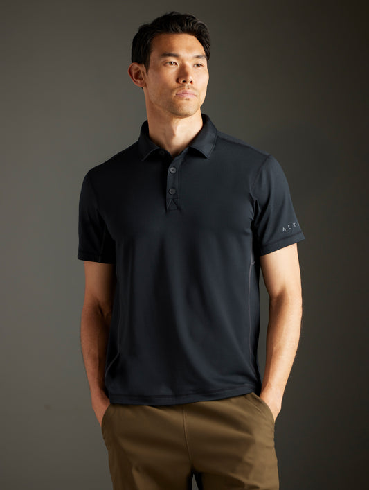 man wearing black polo from AETHER Apparel