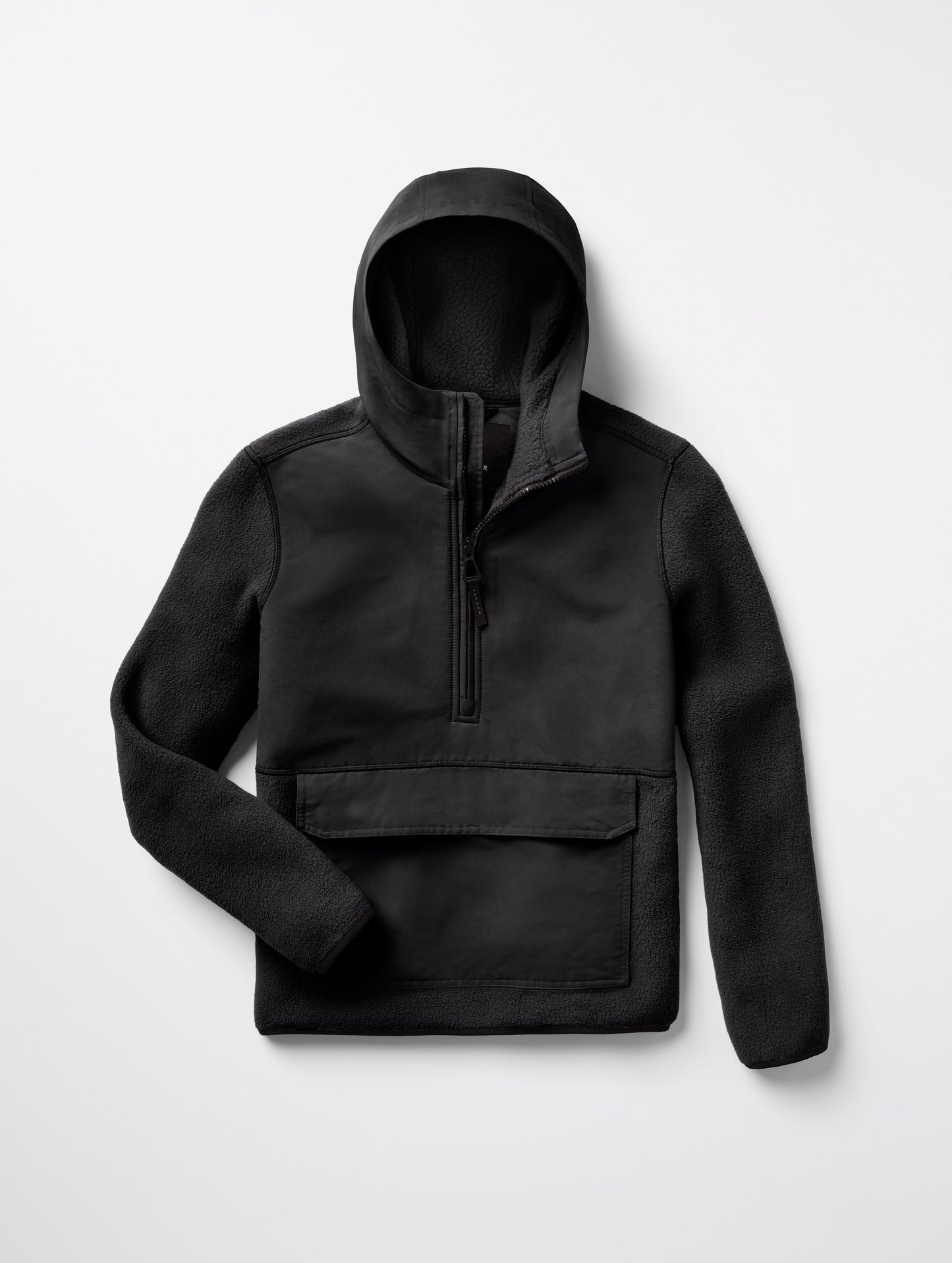 Flat lay of Walsh Hooded Anorak in Onyx Black from AETHER Apparel.