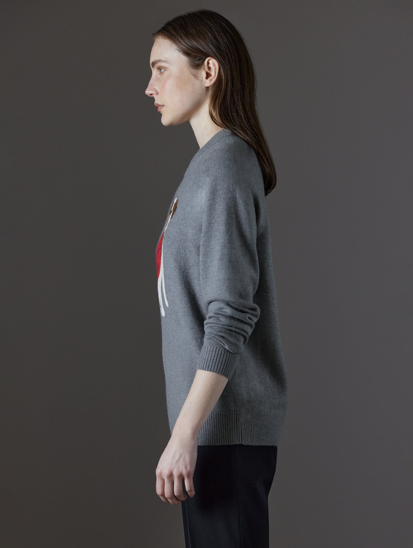 Side profile view of woman wearing Mosie Sweater in Light Heather Grey from AETHER Apparel.