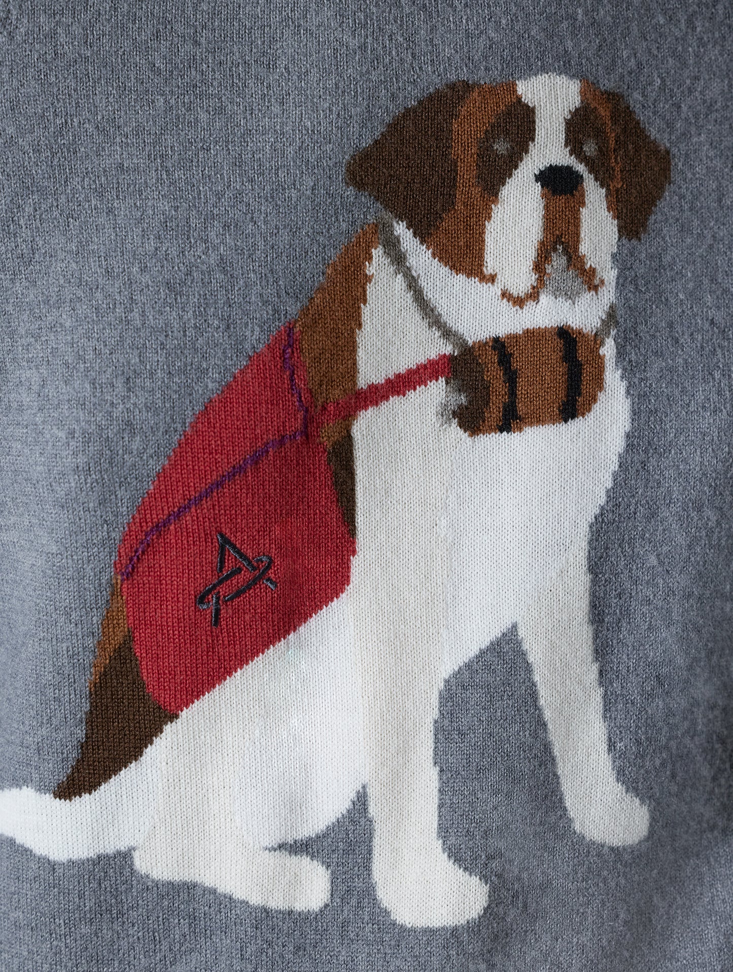 Closeup detailed view of jacquard Saint Bernard dog design on front of women’s Mosie Sweater in Light Heather Grey from AETHER Apparel.