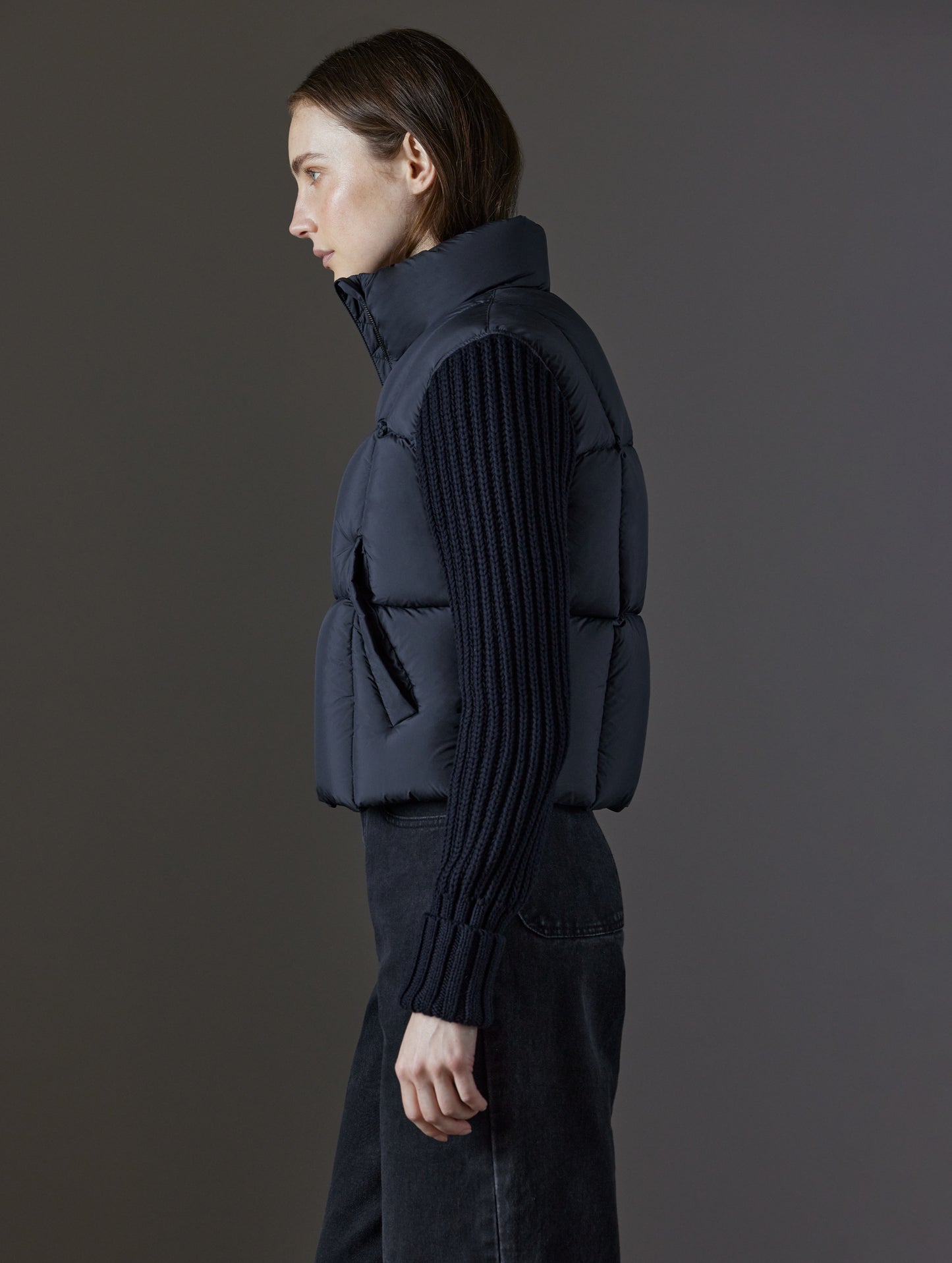 Side profile view of woman wearing Nina Cardigan-Sleeve Jacket in Onyx Black from AETHER Apparel.