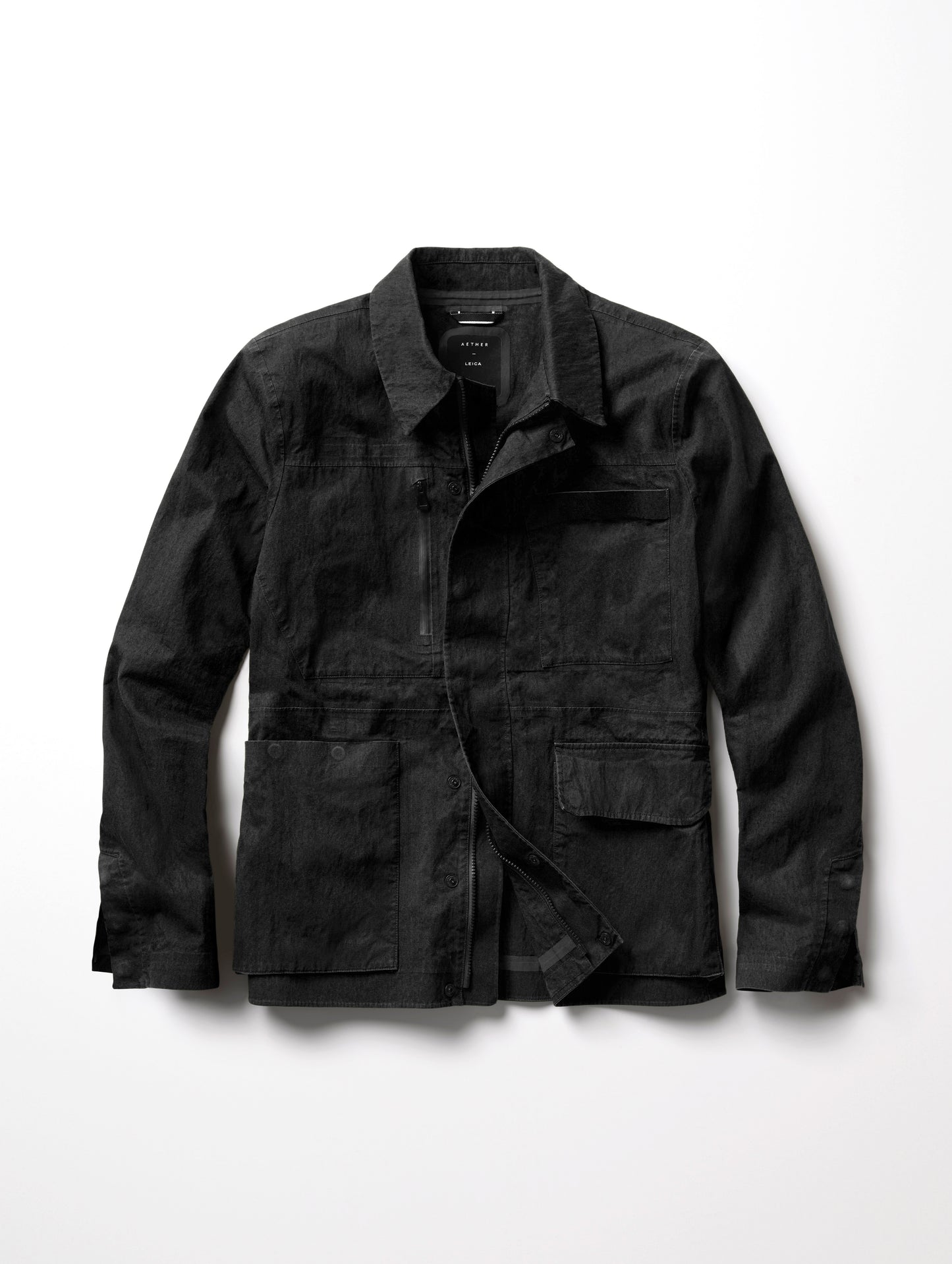 Flat lay image of the men's Monochrom AETHER + LEICA Reporter Jacket.