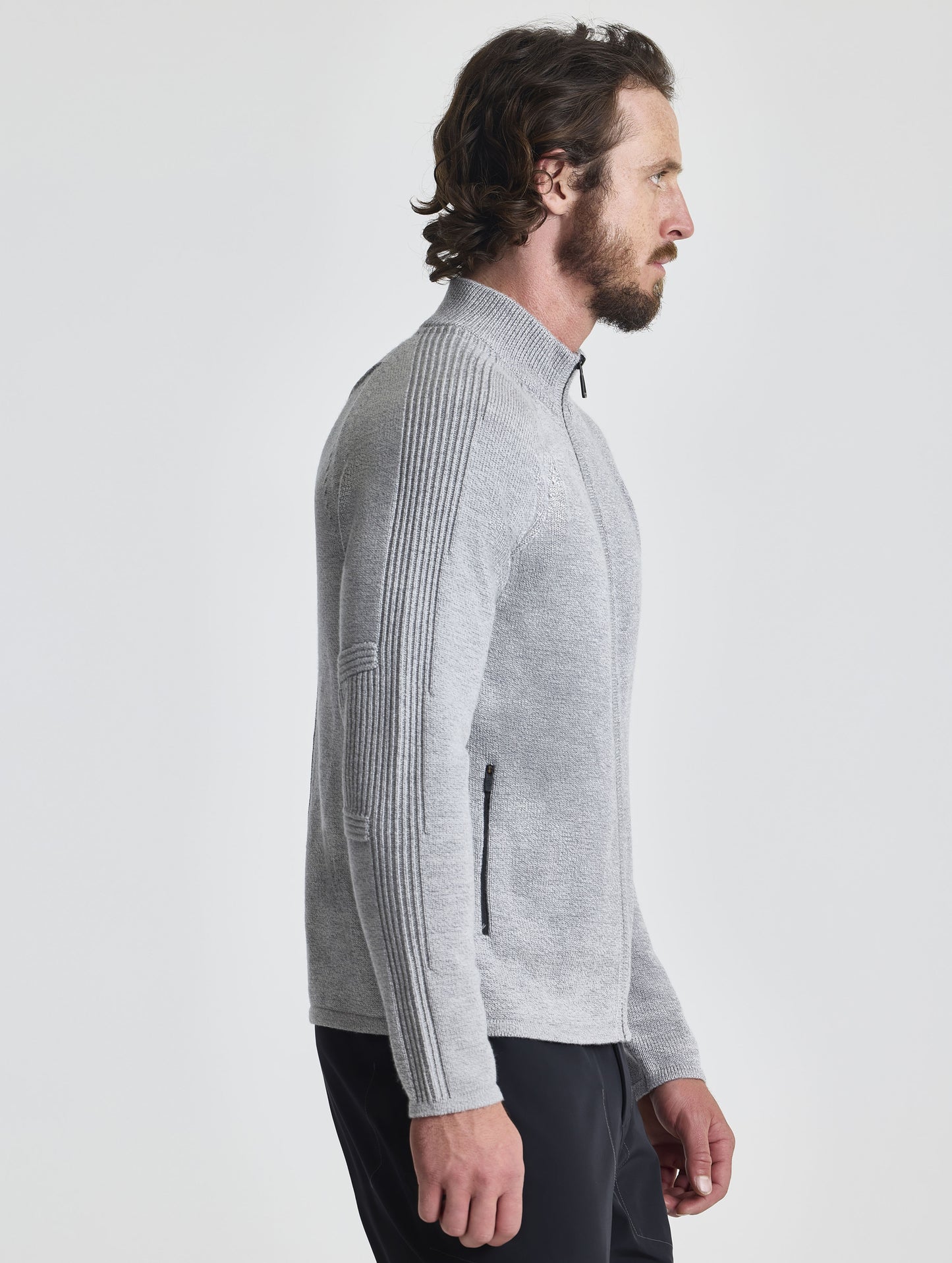 Right profile view of man wearing Riley Full-Zip Sweater in Light Heather Grey from AETHER Apparel.