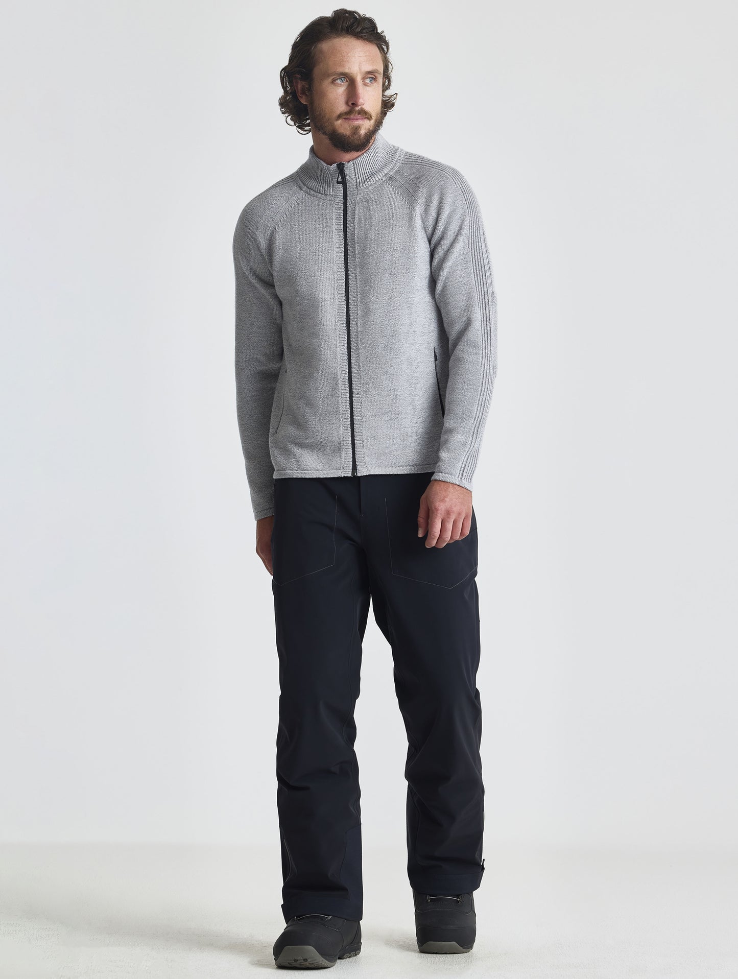 Full body view of man wearing Riley Full-Zip Sweater in Light Heather Grey from AETHER Apparel.