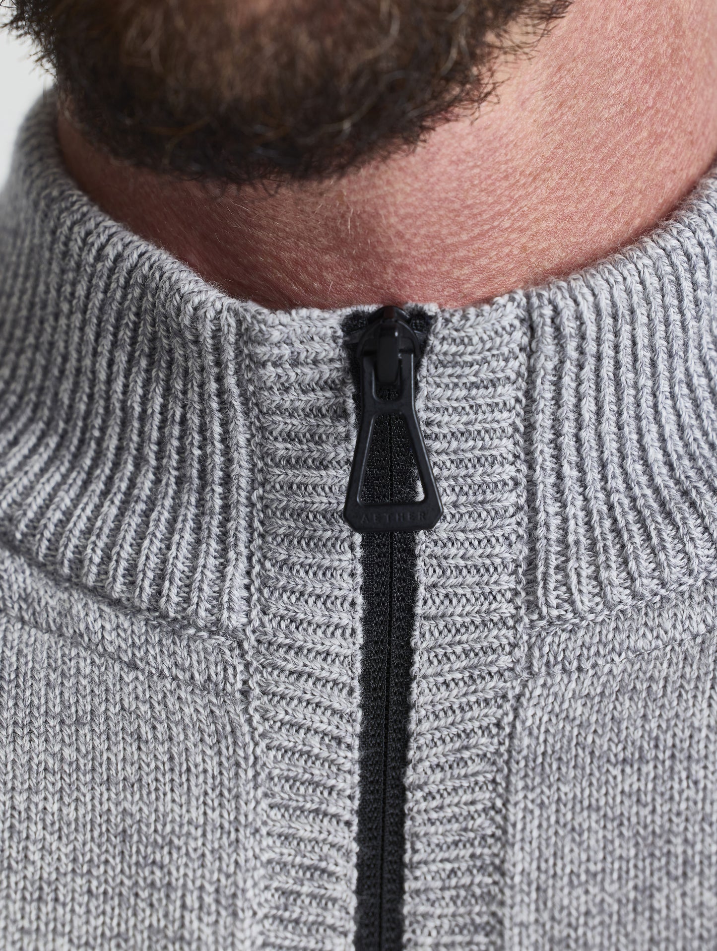 Closeup view of collar of Riley Full-Zip Sweater in Light Heather Grey from AETHER Apparel.